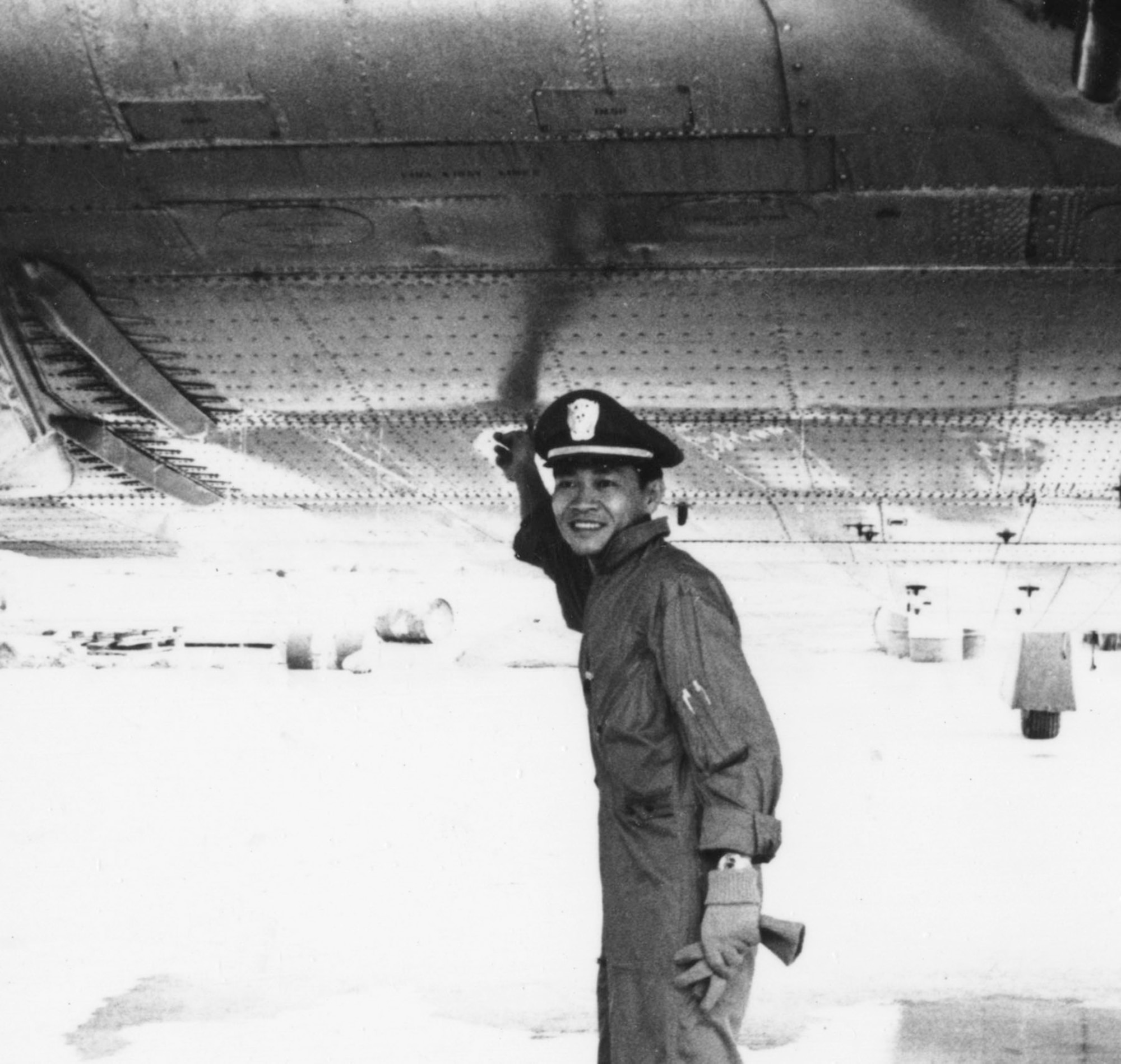 "Dirty Thirty" missions often received ground fire. VNAF Lt. Tam points to a bullet hole that pierced this aircraft’s fuel tanks. (U.S. Air Force photo)