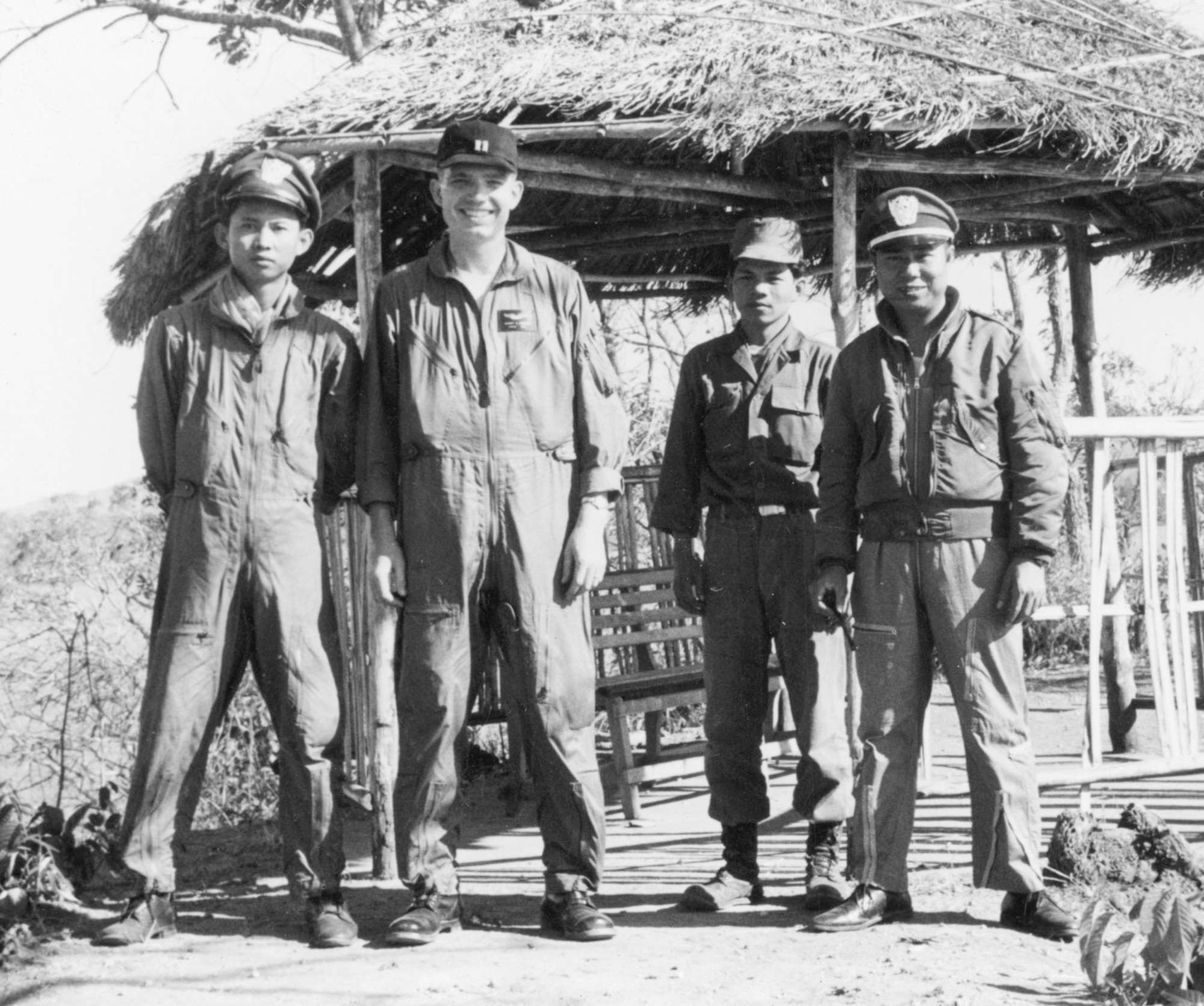 "Dirty Thirty" pilot with VNAF personnel at Pleiku, South Vietnam, in 1963. (U.S. Air Force photo)