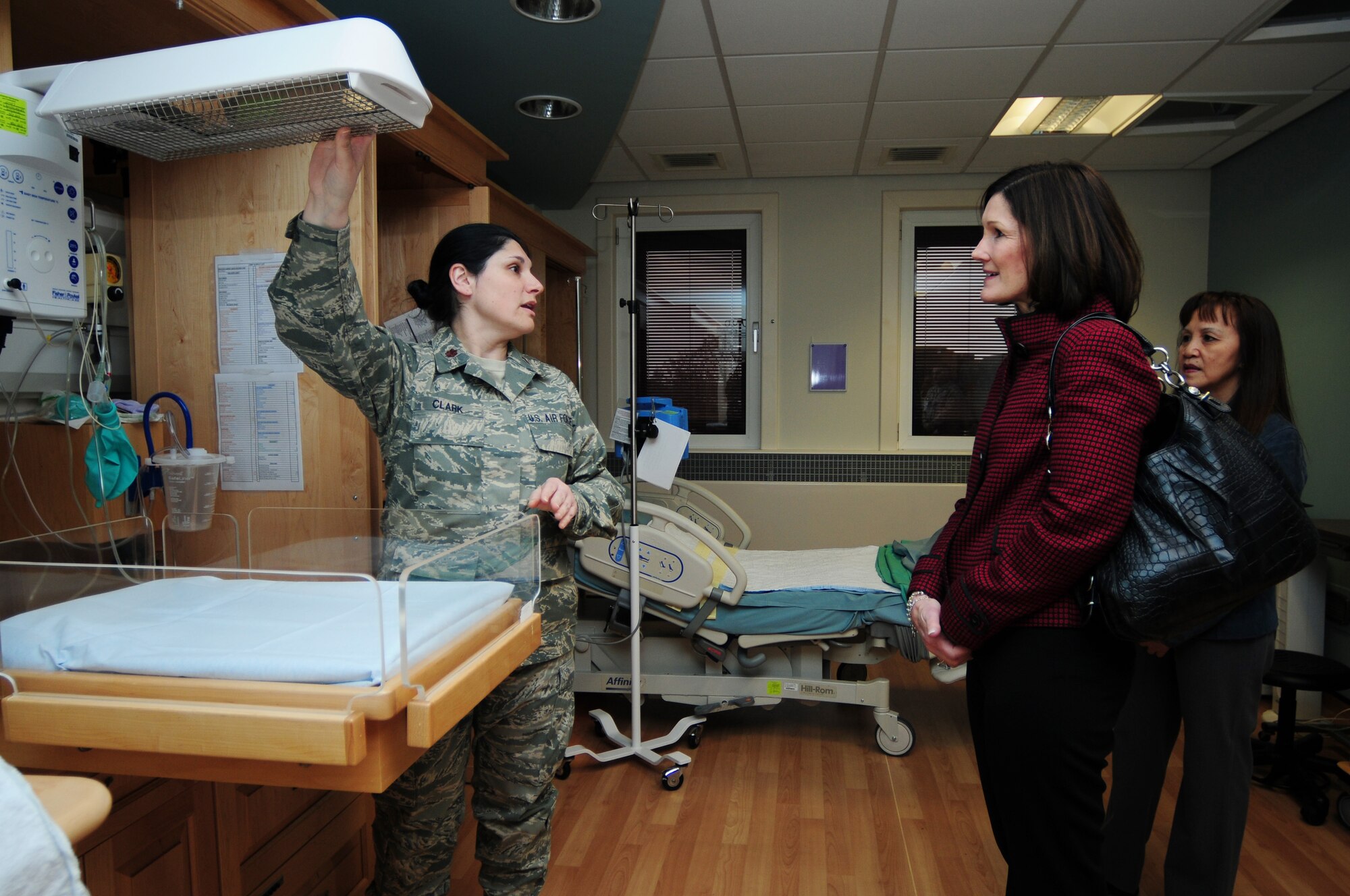 ROYAL AIR FORCE LAKENHEATH, England -- Maj. Theresa Clark, 48th Inpatient Squadron flight commander, shows Betty Welsh, wife of Gen. Mark A. Welsh III, United States Air Forces in Europe commander, and Mary Williamson, wife of Chief Master Sgt. David Williamson, USAFE command chief, patient facilities and accommodations in the obstetrics ward, Jan. 18, 2012. The group visited RAF Lakenheath to express their gratitude for the hard work and dedication of the Liberty warriors and their families, and to discuss upcoming changes in today's Air Force. (U.S. Air Force photo by Senior Airman Lausanne Morgan)