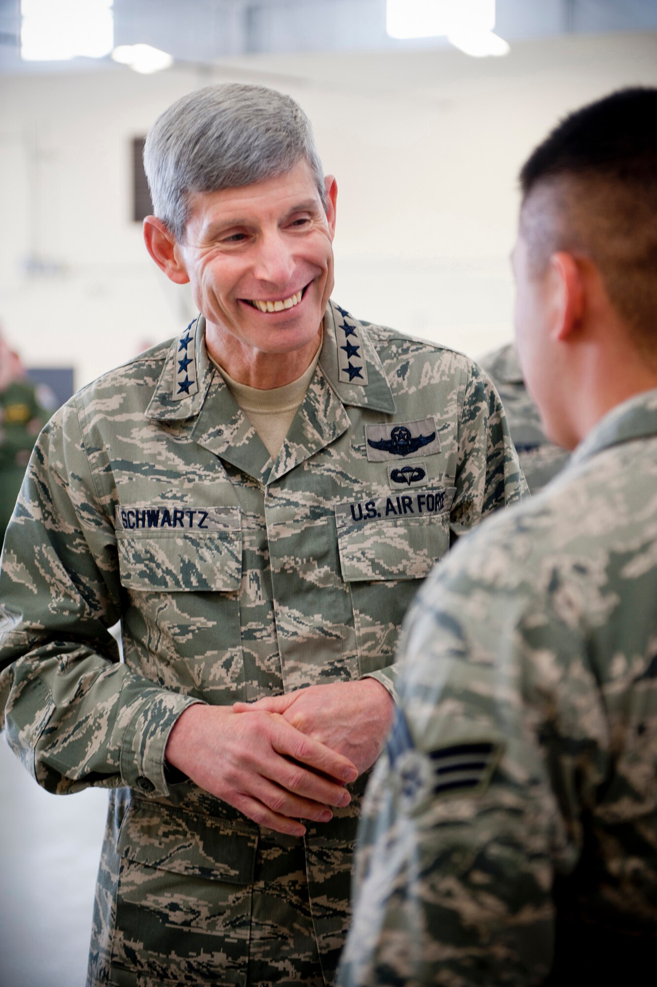 Air Force Chief of Staff Gen. Norton Schwartz speaks with U.S. Air Force Senior Airman Nathaniel Salemka, 23d Fighter Group, during a visit to Moody Air Force Base, Ga., Jan. 18, 2012. Schwartz met with Airmen from the 23d Fighter Group and other various units to thank them for what they do and to get their views on life in the Air Force. (U.S. Air Force photo by Staff Sgt. Jamal D. Sutter/Released)