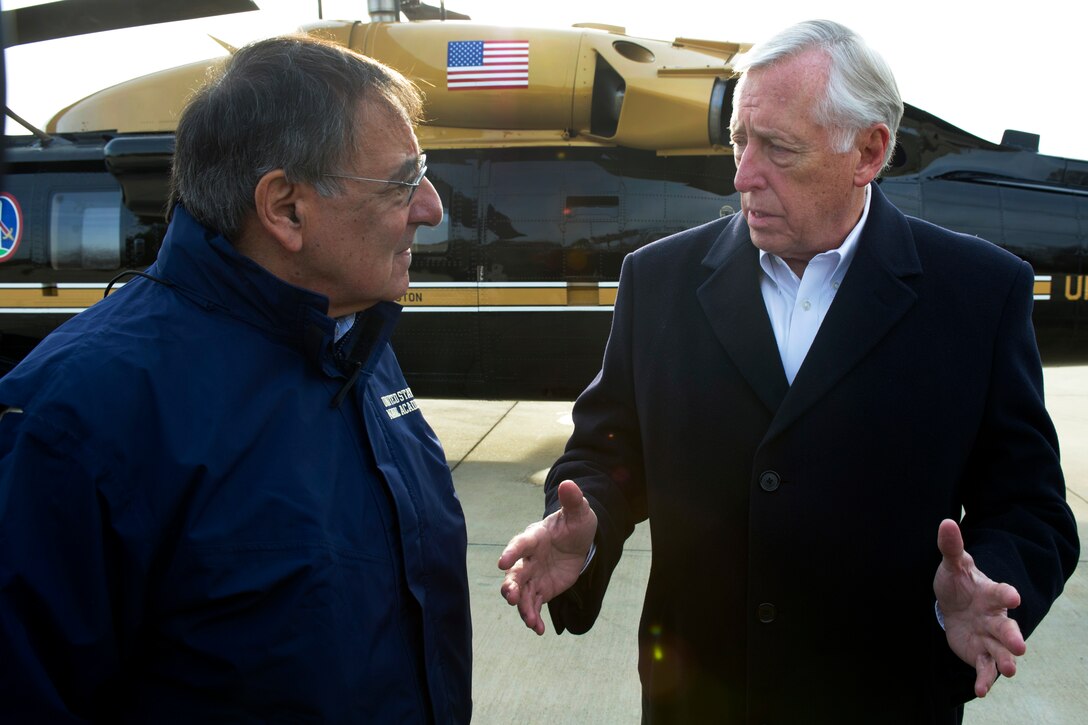 U.S. Rep. Steny H. Hoyer, of Maryland, right, greets Defense Secretary Leon E. Panetta upon his arrival at Naval Air Station Patuxent River, Md., Jan.  20, 2012. Panetta and Hoyer toured F-35 Joint Strike Fighter facilities at the base, where the aircraft is in testing. 