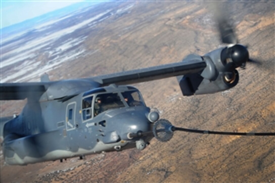 A 71st Special Operations Squadron CV-22 Osprey receives fuel from a 522nd Special Operation Squadron MC-130J Combat Shadow II over New Mexico on Jan. 4, 2012.  The 71st Special Operations Squadron is located at Kirtland Air Force Base, N.M., and conducts air refueling training with members of the 522nd at Cannon Air Force Base, N.M.  