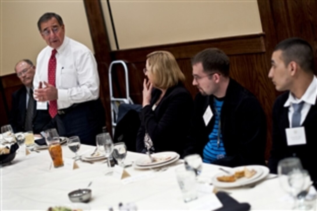 Defense Secretary Leon E. Panetta hosts a dinner to honor 12 wounded warriors and their caregivers at Maggiano's Little Italy in Washington, D.C., Jan. 19, 2012. Panetta hosted the dinner to thank them for their sacrifices and get their opinions on their treatment and how to improve the care system.