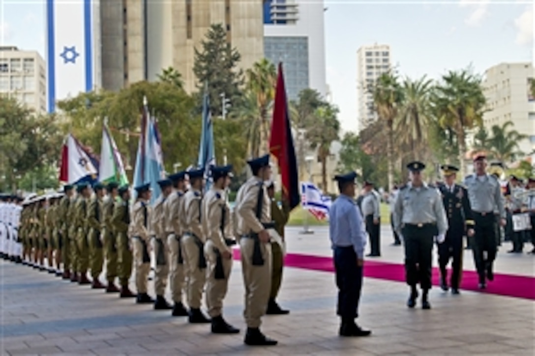 U.S. Army Gen. Martin E. Dempsey, chairman of the Joint Chiefs of Staff, reviews an Israeli honor guard at the Rabin military base in Tel Aviv, Israel, Jan. 20, 2012.