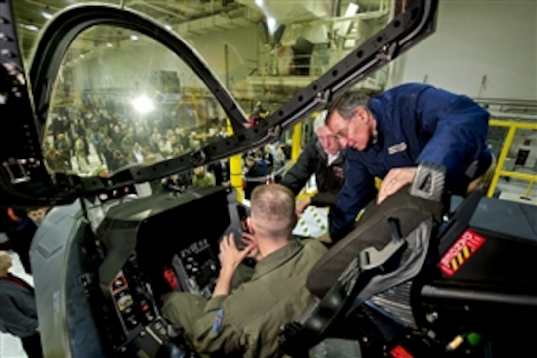 Defense Secretary Leon E. Panetta and U.S. Rep. Steny H. Hoyer of Maryland look at the cockpit of the F-35 Joint Strike Fighter with Navy Capt. Erik "Rock" Etz on Naval Air Station Patuxent River, Md., Jan. 20, 2012. Panetta and Hoyer toured several facilities related to the F-35 Joint Strike Fighter, which is in its test phases at the base.