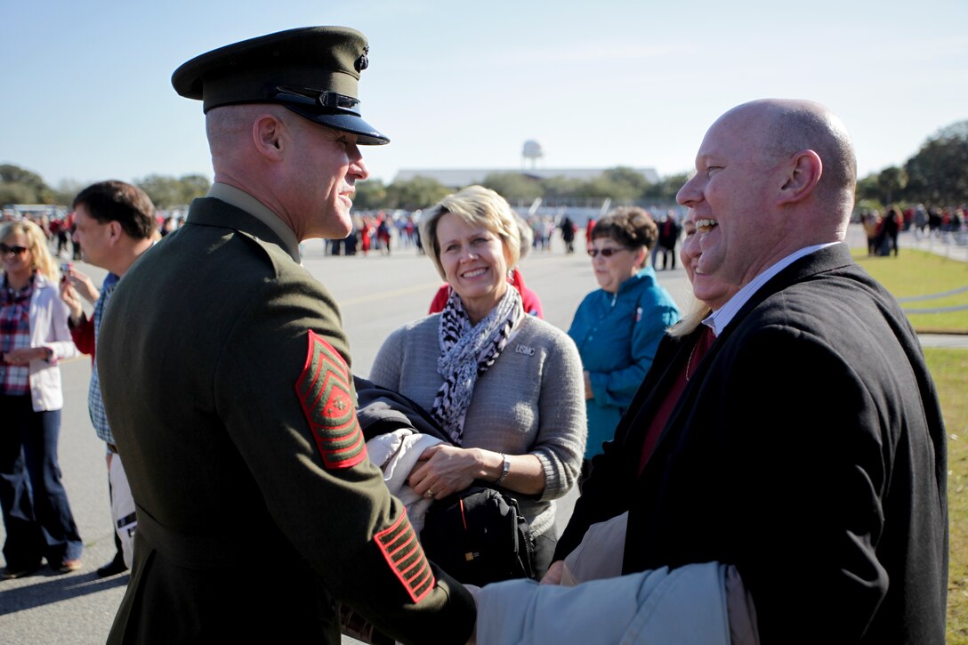 Sgt. Maj. Micheal P. Barrett, the 17th Sergeant Major of the Marine Corps, speacks with the family and friends of Pfc. Andrew Willis following the graduation of Charlie Company, 1st Recruit Training Battalion, at Marine Corps Recruit Depot Parris Island, S.C., Jan. 20, 2012.