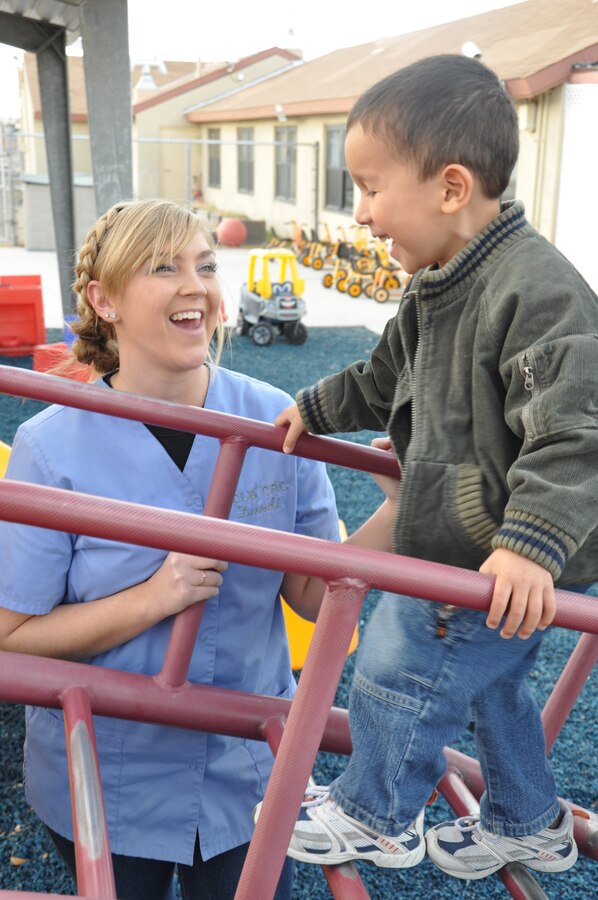 Joanna Droegemeier, a child care and development specialist at the Child Development Center aboard Marine Corps Logistics Base Barstow laughs with Jacob Flores outside the CDC Jan. 20. While not at the CDC, Droegemeier, a Barstow, Calif. native, is a student full time at California State University-Fullerton as an elementary education major.