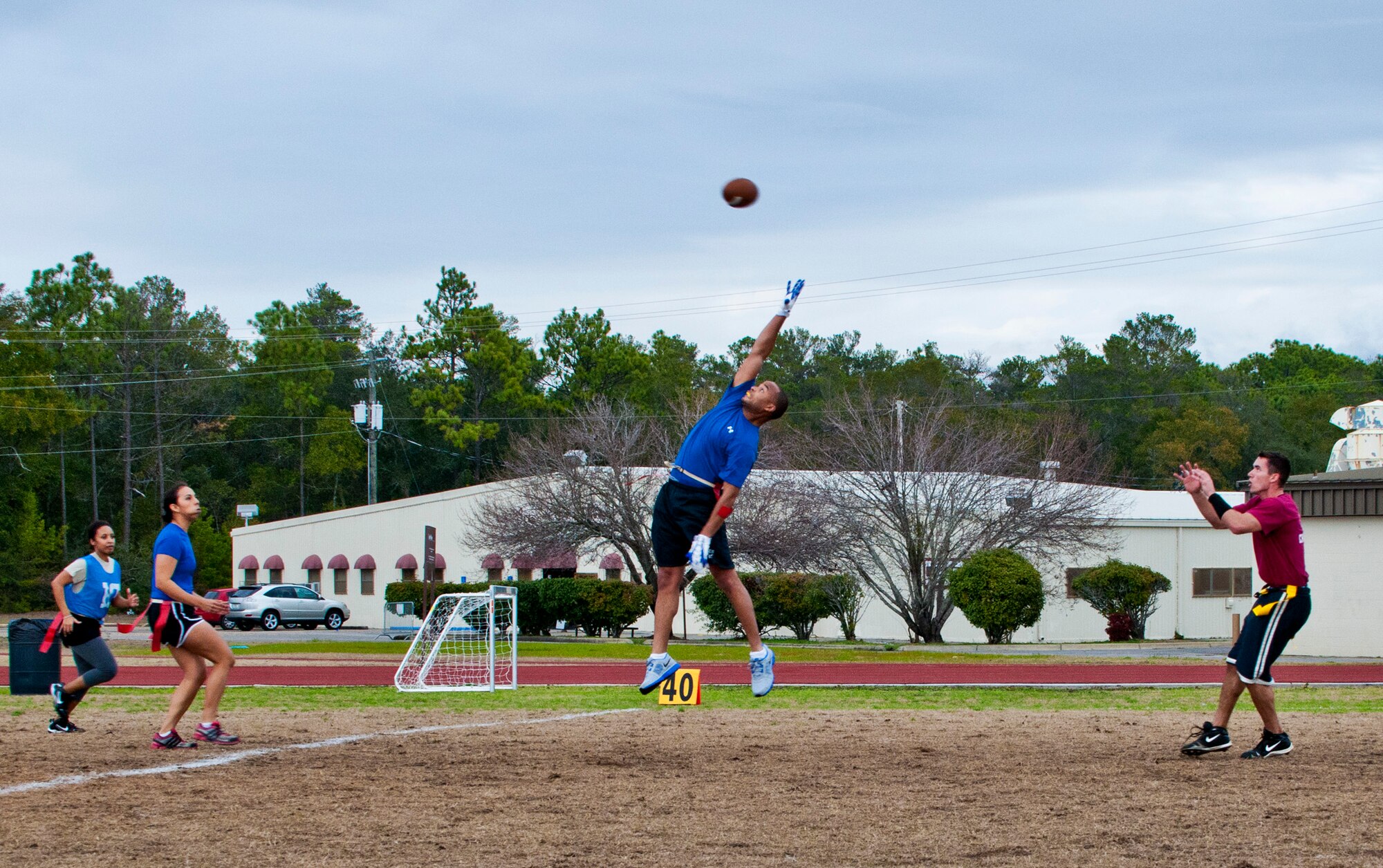 The 5/6 Council player can't get high enough to block a pass from the Company Grade Officers Council team during their flag-football match-up at Eglin Air Force Base, Fla. Jan. 20.  The CGOC shut out 5/6 38-0.  (U.S. Air Force photo/Samuel King Jr.)
