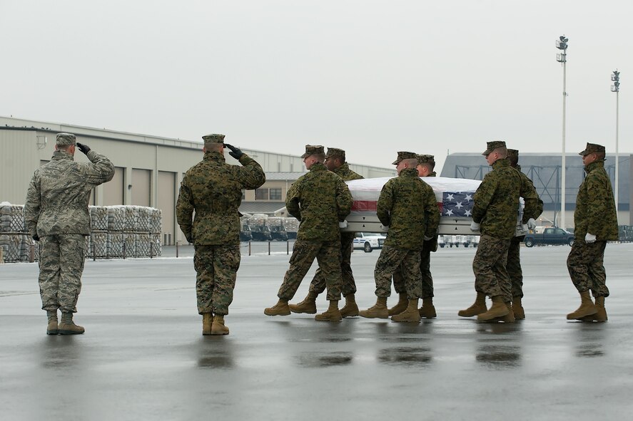 A U.S. Marine Corps carry team transfers the remains of Marine Cpl. Phillip D. McGeath, of Glendale, Ariz., at Dover Air Force Base, Del., Jan. 21, 2012. McGeath was assigned to the 1st Battalion, 6th Marine Regiment, 2nd Marine Division, II Marine Expeditionary Force, Camp Lejeune, N.C. (U.S. Air Force photo/Steve Kotecki)