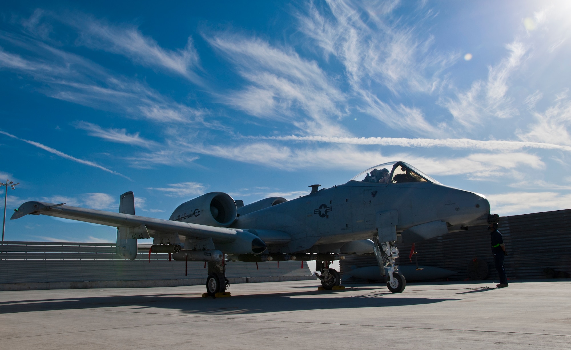 KANDAHAR AIRFIELD, Afghanistan -- A 451st Expeditionary Aircraft Maintenance Squadron crew chief waits for the pilot’s call to pull the chalks during an A-10 Thunderbolt II launch at Kandahar Airfield, Afghanistan Jan. 20, 2012. Kandahar’s A-10s provide close-air support for U.S. and coalition ground troops throughout Afghanistan. (U.S. Air Force photo by Staff Sgt. David Carbajal)