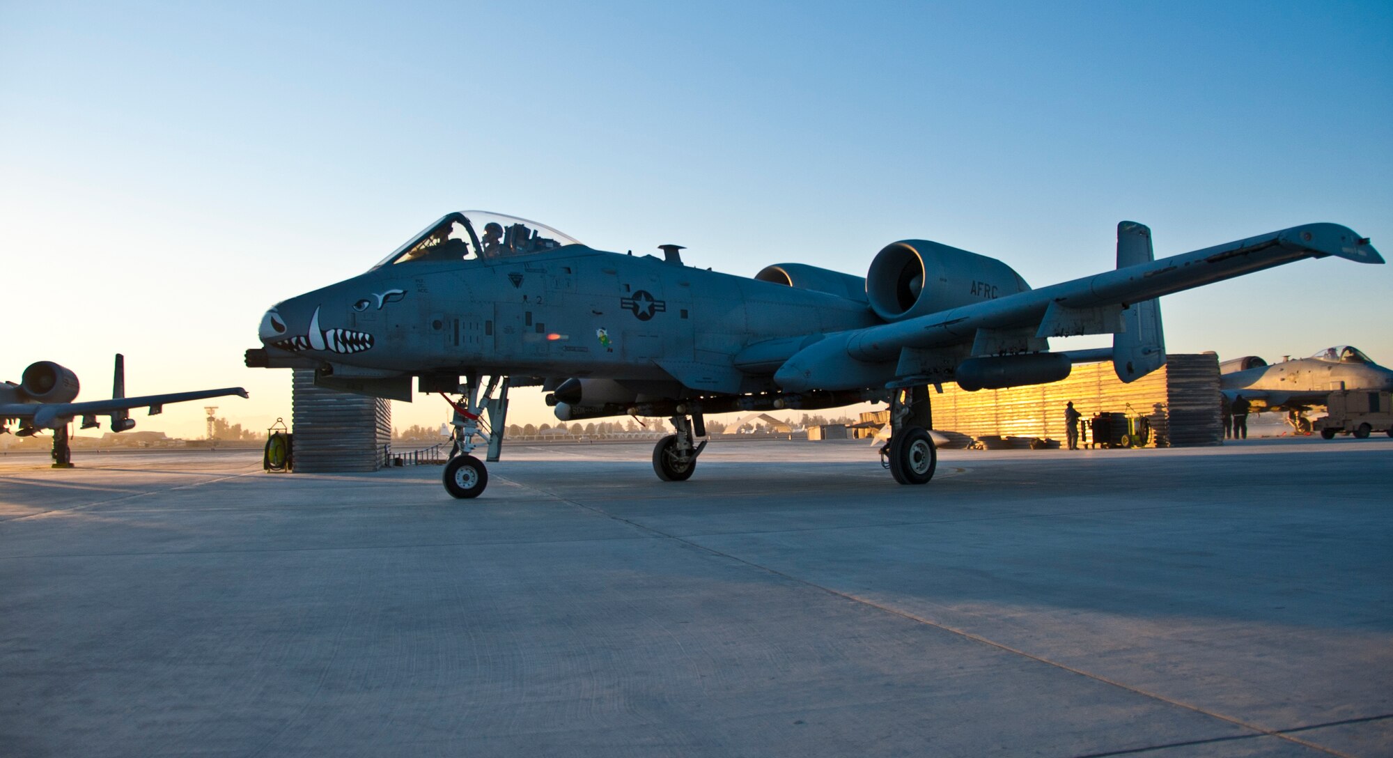 KANDAHAR AIRFIELD, Afghanistan -- An A-10 Thunderbolt II pilot taxis to the runway at Kandahar Airfield, Afghanistan Jan. 20, 2012. The A-10 fires a 30-millimeter cannon and can carry up to 16,000 pounds of ordnance for close air support missions to support troops on the ground. (U.S. Air Force photo by Staff Sgt. David Carbajal)