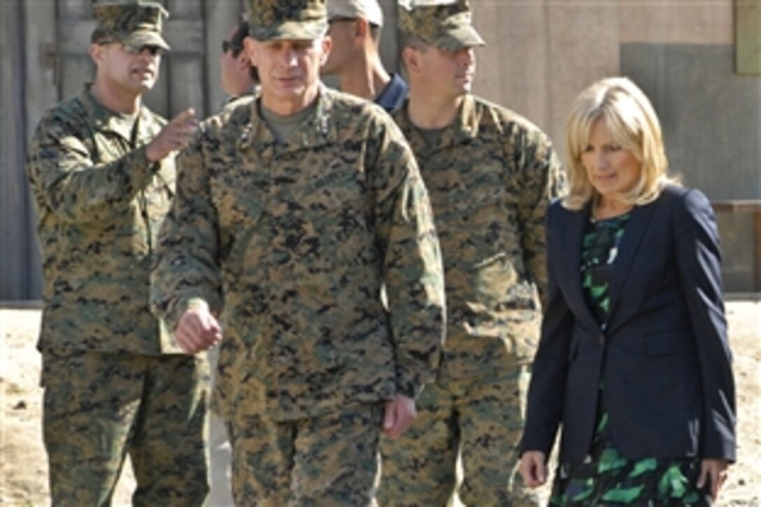 Dr. Jill Biden, wife of Vice President Joe Biden, wraps up her trip to the Infantry Immersion Trainer on Marine Corps Base Camp Pendleton, Calif., Jan. 20, 2012. Biden is escorted by Marine Corps Lt. Gen. Thomas D. Waldhauser, commander of 1st Marine Expeditionary Force and U.S. Marine Corps Forces Central Command.