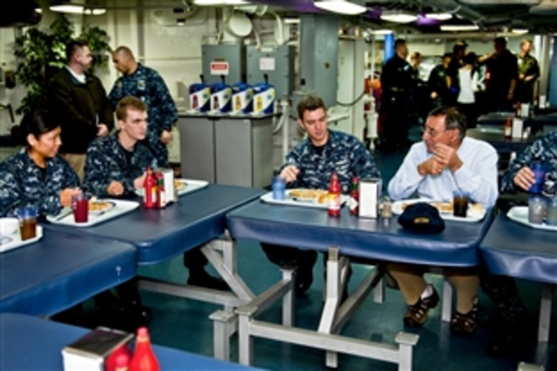 Defense Secretary Leon E. Panetta speaks to the crew during lunch aboard the aircraft carrier USS Enterprise in the Atlantic Ocean, Jan. 21, 2012. The Enterprise Carrier Strike Group is conducting a composite training unit exercise.