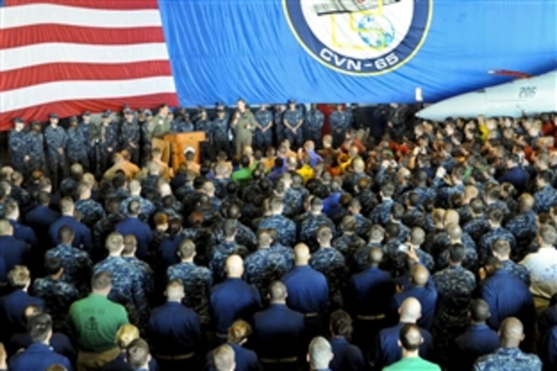 Navy Rear Adm. Walter E. Carter Jr., commander of Carrier Strike Group 12, introduces Defense Secretary Leon E. Panetta during an all-hands call aboard aircraft carrier USS Enterprise in the Atlantic Ocean, Jan. 21, 2012. The Enterprise Carrier Strike Group is conducting a composite training unit exercise.