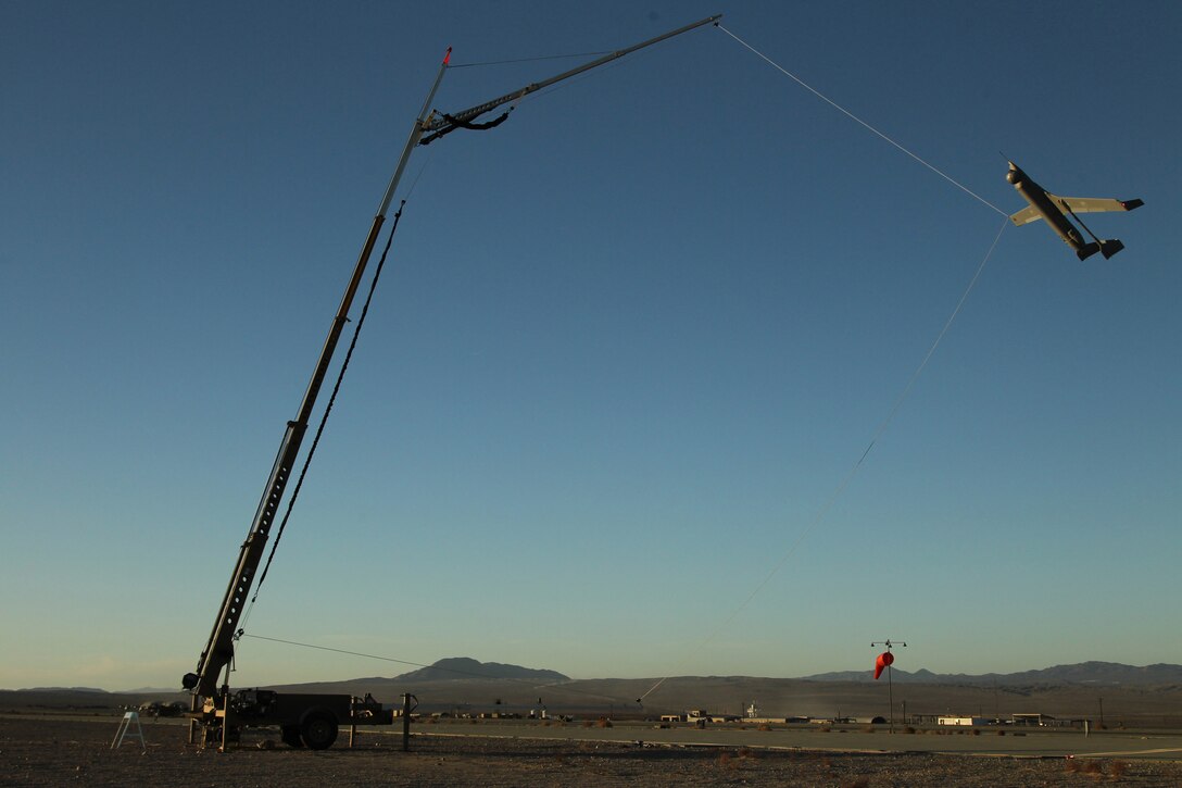 A new unmanned aerial vehicle, the Integrator, is recovered using a mobile catcher wire instead of the traditional landing strip a sneak preview for Unmanned Aerial Vehicle Squadrons 2 and 3 at the VMU-3 airfield Jan. 22, 2012.
