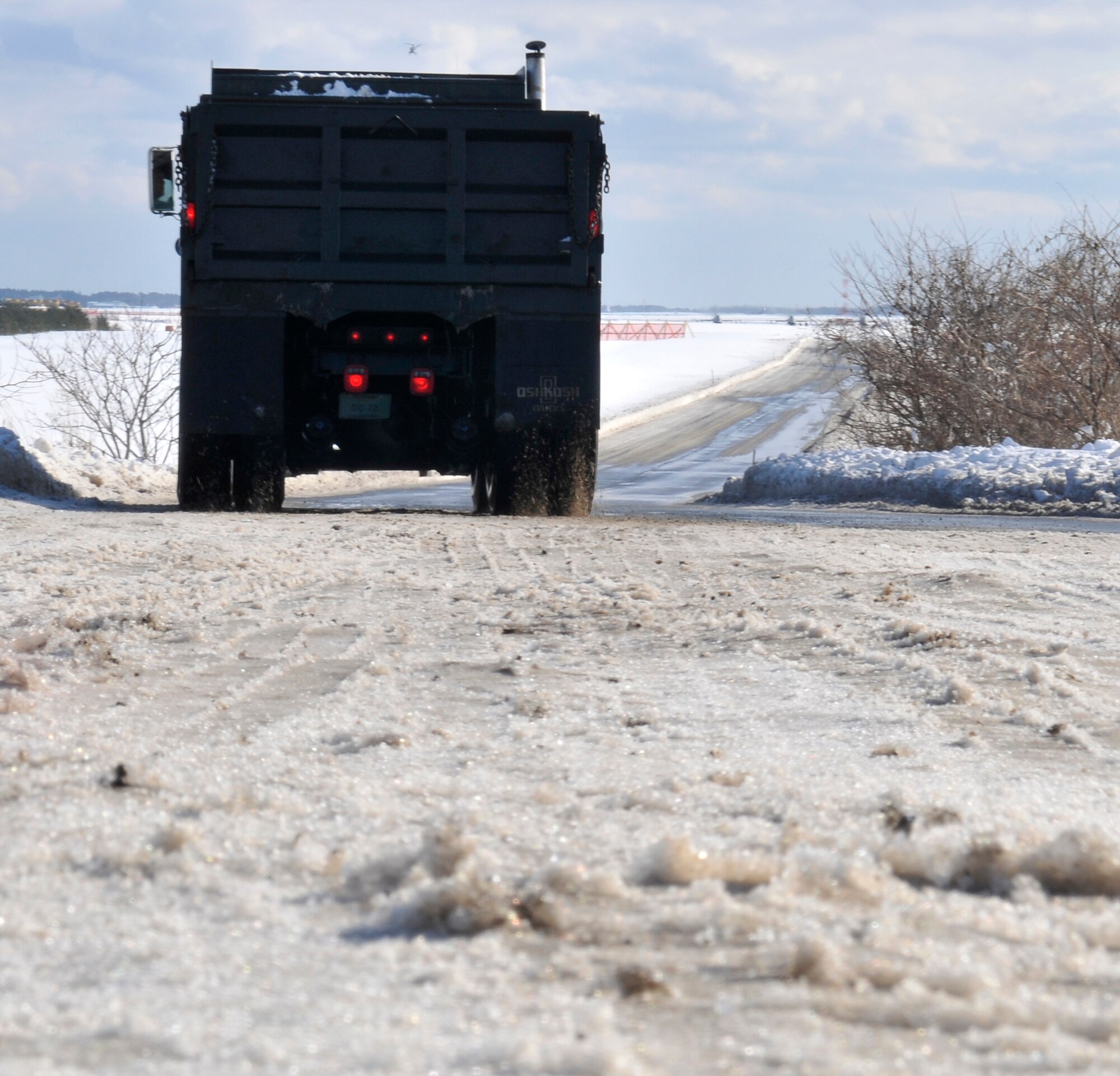 MISAWA AIR BASE, Japan – A 10-ton truck heads to Falcon Drive to collect another load of snow Jan. 19. Each truck can hold approximately 10-tons of material. (U.S. Air Force photo by Tech. Sgt Phillip Butterfield) 