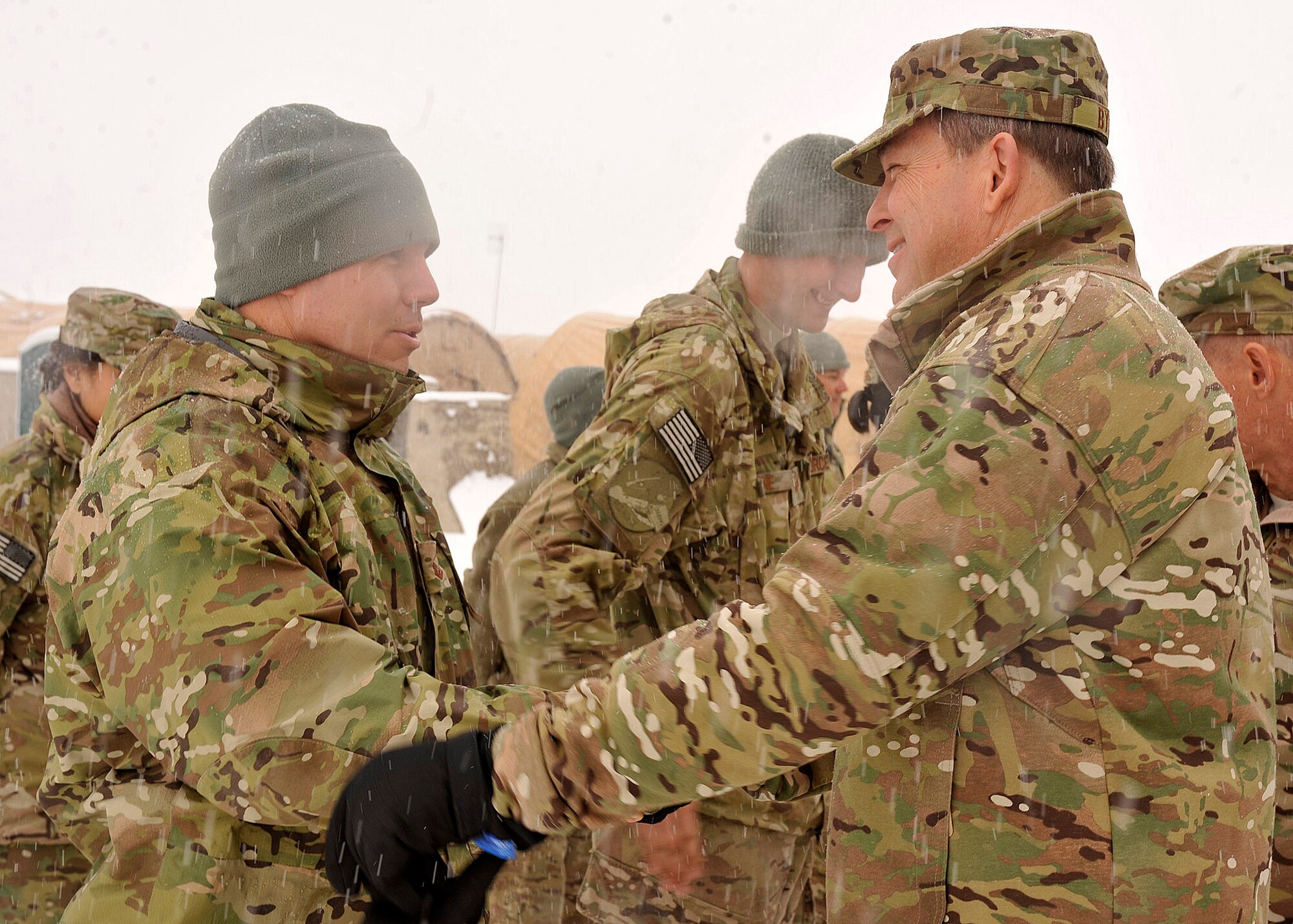 BAGRAM AIRFIELD, Afghanistan-- Maj. Gen. Timothy A. Byers greets Master Sgt. John Mathis at Bagram Airfield Jan. 22, 2012. Byers is the commander of Air Force Civil Engineers, Headquarters, Washington, D.C. He visited Bagram in order to boost morale among his deployed Airmen. (U.S. Air Force photo/ Airman 1st Class Ericka Engblom)