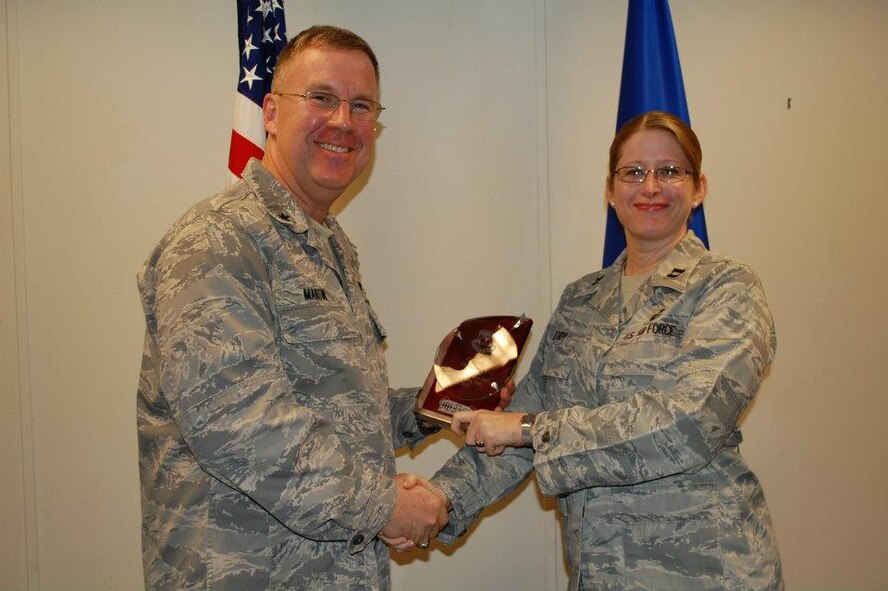 Capt. Faith Eudy, assigned to the 442nd Fighter Wing, as a reservist, recently was awarded Company Grade Officer of the Year for Headquarters 18th Air Force Staff, where she works on the commander's action group throughout the week. The 442nd FW is an A-10 Thunderbolt II Air Force Reserve unit at Whiteman Air Force Base, Mo. Eighteenth Air Force, is a numbered command located at Scott Air Force Base, Ill. (U.S. Air Force photo/Courtesy photo)