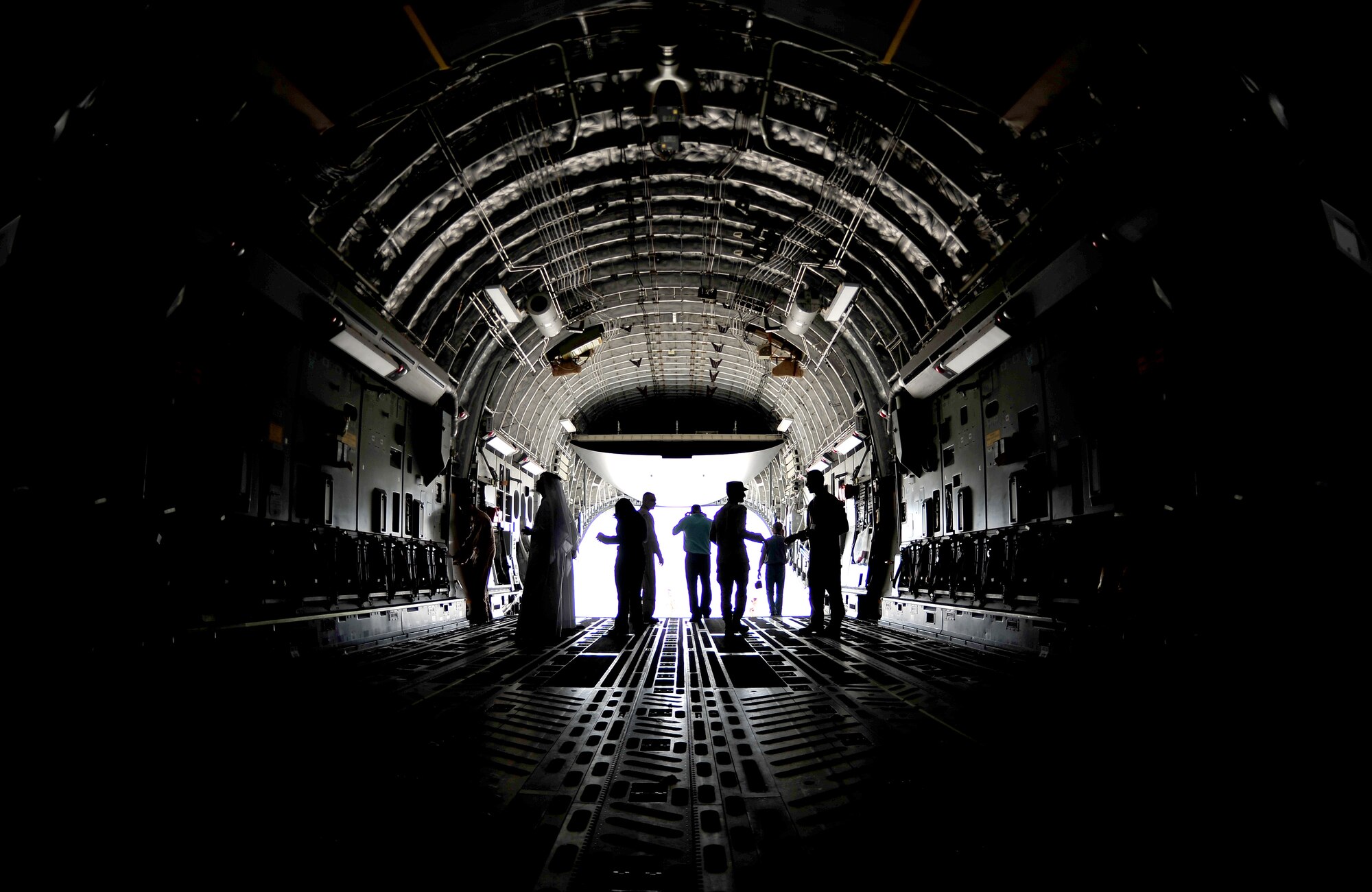 Airshow spectators take a tour of a C-17 Globemaster III on static display during the Bahrain International Airshow 2012 at Shakir Air Base, Bahrain Jan. 19, 2012. This event strengthens partnerships in the region and allows the United States and coalition and partner nations to work together to promote security, stability and mutual interests in the region. The U.S. Air Force showcased a variety of military aircraft through static displays, including the C-17 Globemaster III, C-130H Hercules, and F-15E Strike Eagle. Additionally, a large number of aircrew and support personnel from bases in Southwest Asia, Europe, and the United States were available to answer questions about the aircraft technology and capabilities. (U.S. Air Force photo by Staff Sgt. Andy M. Kin)