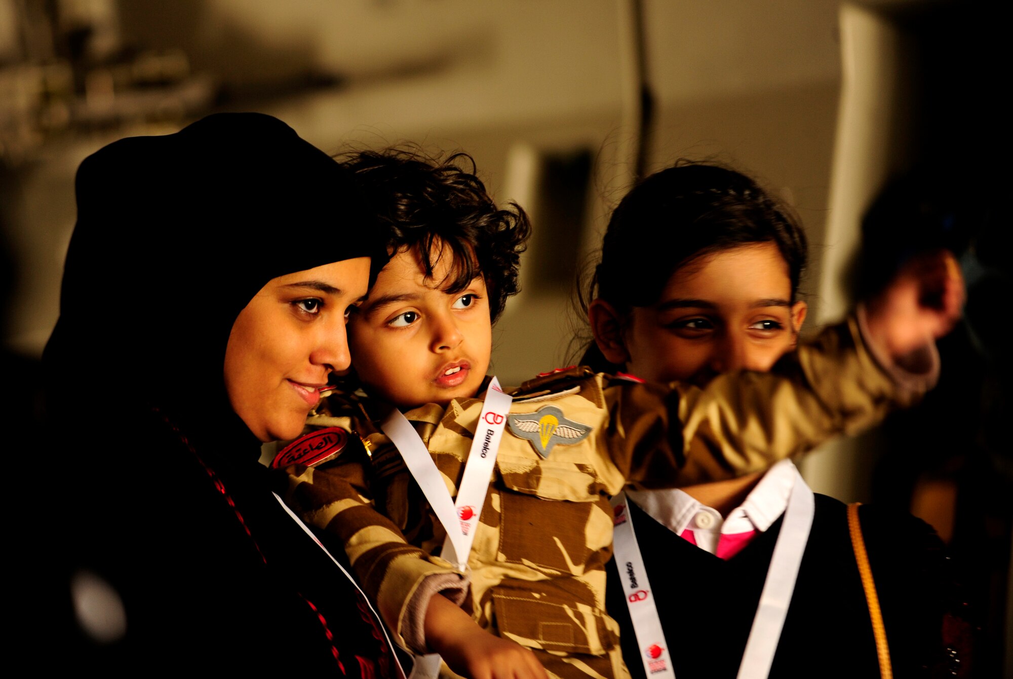 Airshow spectators take a tour of a C-17 Globemaster III on static display during the Bahrain International Airshow 2012 at Shakir Air Base, Bahrain Jan. 19, 2012. This event strengthens partnerships in the region and allows the United States and coalition and partner nations, work together to promote security, stability and mutual interests in the region. The U.S. Air Force showcased a variety of military aircraft through static displays, including the C-17 Globemaster III, C-130H Hercules, and F-15E Strike Eagle. Additionally, a large number of aircrew and support personnel from bases in Southwest Asia, Europe, and the United States were available to answer questions about the aircraft technology and capabilities. (U.S. Air Force photo by Staff Sgt. Andy M. Kin)  