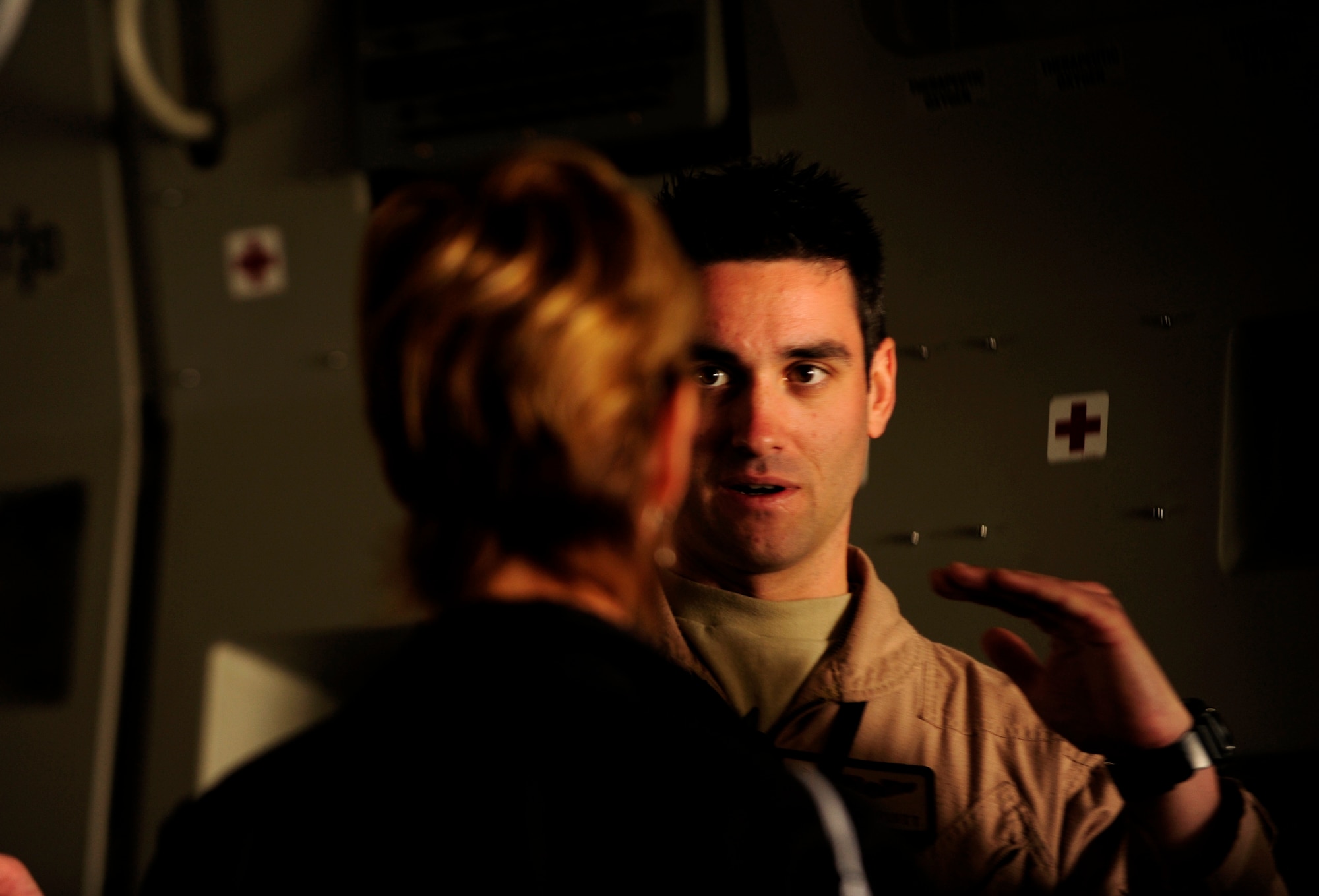 U.S. Air Force 1st Lt. Jacob Pruitt, a C-17 Globemaster III pilot assigned to the 21st Airlift Squadron Travis Air Force Base, Calif., discusses the characteristics of the aircraft at the Bahrain International Airshow 2012 at Shakir Air Base, Bahrain Jan. 19, 2012. This event strengthens partnerships in the region and allows the United States and coalition and partner nations, work together to promote security, stability and mutual interests in the region. The U.S. Air Force showcased a variety of military aircraft through static displays, including the C-17 Globemaster III, C-130H Hercules, and F-15E Strike Eagle. Additionally, a large number of aircrew and support personnel from bases in Southwest Asia, Europe, and the United States were available to answer questions about the aircraft technology and capabilities. (U.S. Air Force photo by Staff Sgt. Andy M. Kin)