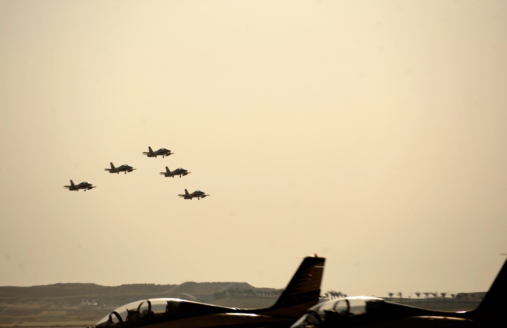 The United Arab Emirates Al Fursan display team performs during the Bahrain International Airshow 2012 at Shakir Air Base, Bahrain Jan. 19, 2012. This event strengthens partnerships in the region and allows the United States and coalition and partner nations, work together to promote security, stability and mutual interests in the region. The U.S. Air Force showcased a variety of military aircraft through static displays, including the C-17 Globemaster III, C-130H Hercules, and F-15E Strike Eagle. Additionally, a large number of aircrew and support personnel from bases in Southwest Asia, Europe, and the United States were available to answer questions about the aircraft technology and capabilities. (U.S. Air Force photo by Staff Sgt. Andy M. Kin)   