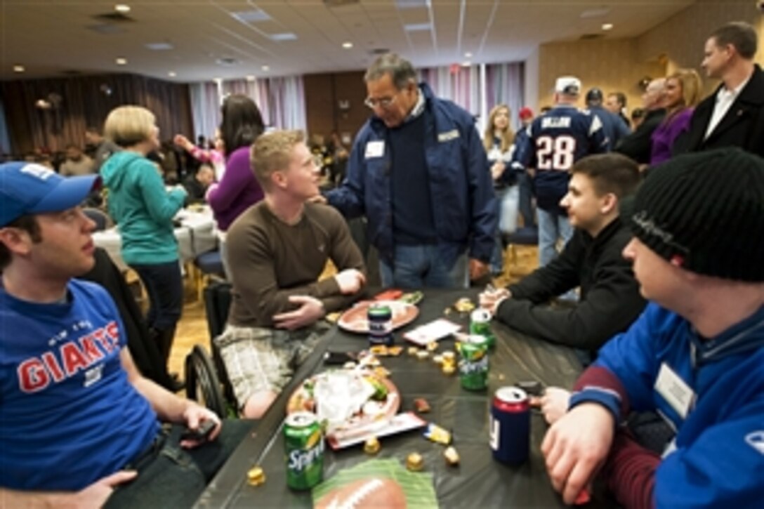 Defense Secretary Leon E. Panetta speaks with wounded warriors from the Walter Reed National Military Medical Center in Bethesda, Md., and Fort Belvoir, Va., during the AFC championship game tailgate party at Joint Base Meyer-Henderson Hall in Arlington, Va., Jan. 22, 2012. Army Gen. Martin E. Dempsey and Navy Adm. James A. Winnefeld, chairman and vice chairman of the Joint Chiefs of Staff respectively, hosted the party.