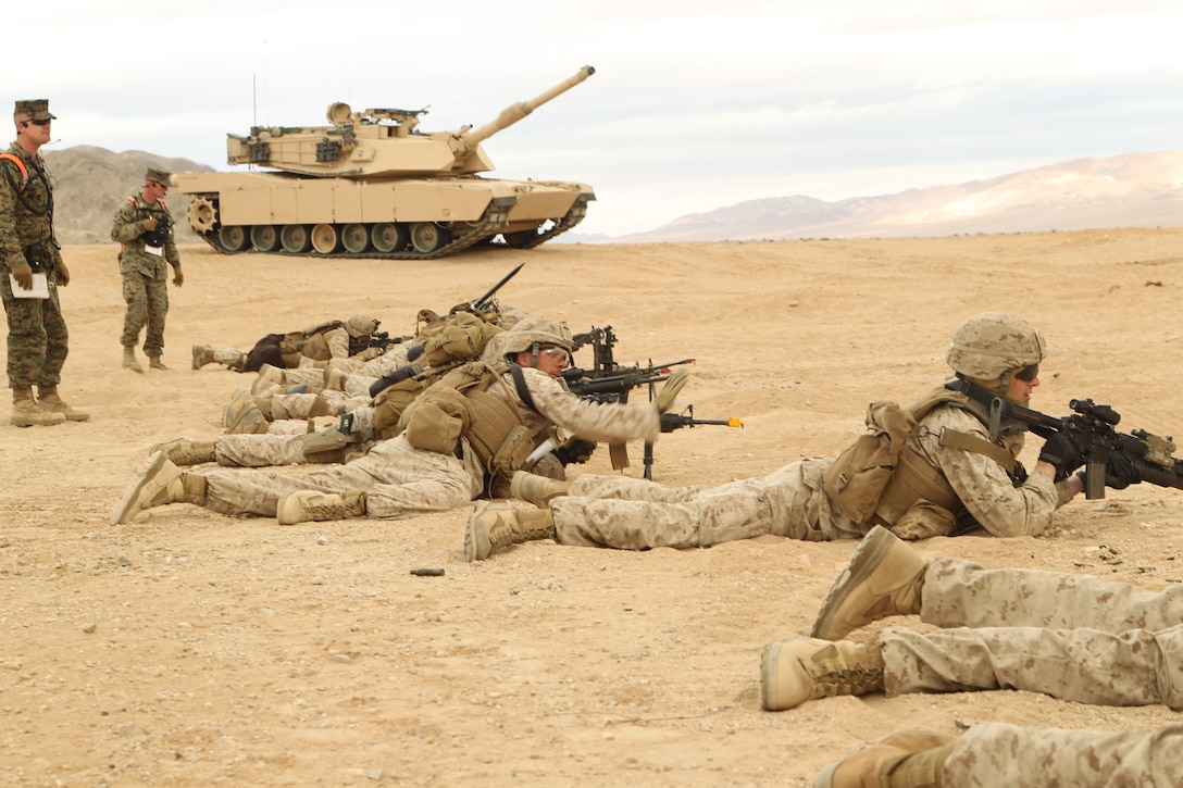 Marines with Company C, 1st Battalion, 7th Marine Regiment, prepare to rush during the Clear, Hold, Build 1 stage of their Enhanced Mojave Viper cycle Jan. 23, 2012.