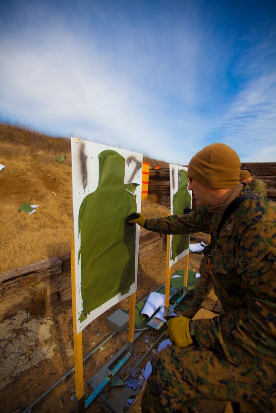Logistics officer Capt. Nickolas Hight, Special Purpose Marine Air Ground Task Force 12.2, tallies his shots after firing an AK-47 assault rifle during foreign weapons familiarization training near Crawfordsville, Ark., Jan. 23, 2012. The Marines and sailors of SPMAGTF 12.2 are deploying to Africa to advise host nation militaries on various military tactics. (U.S. Marine Corps photo by Lance Cpl. Adwin Esters)