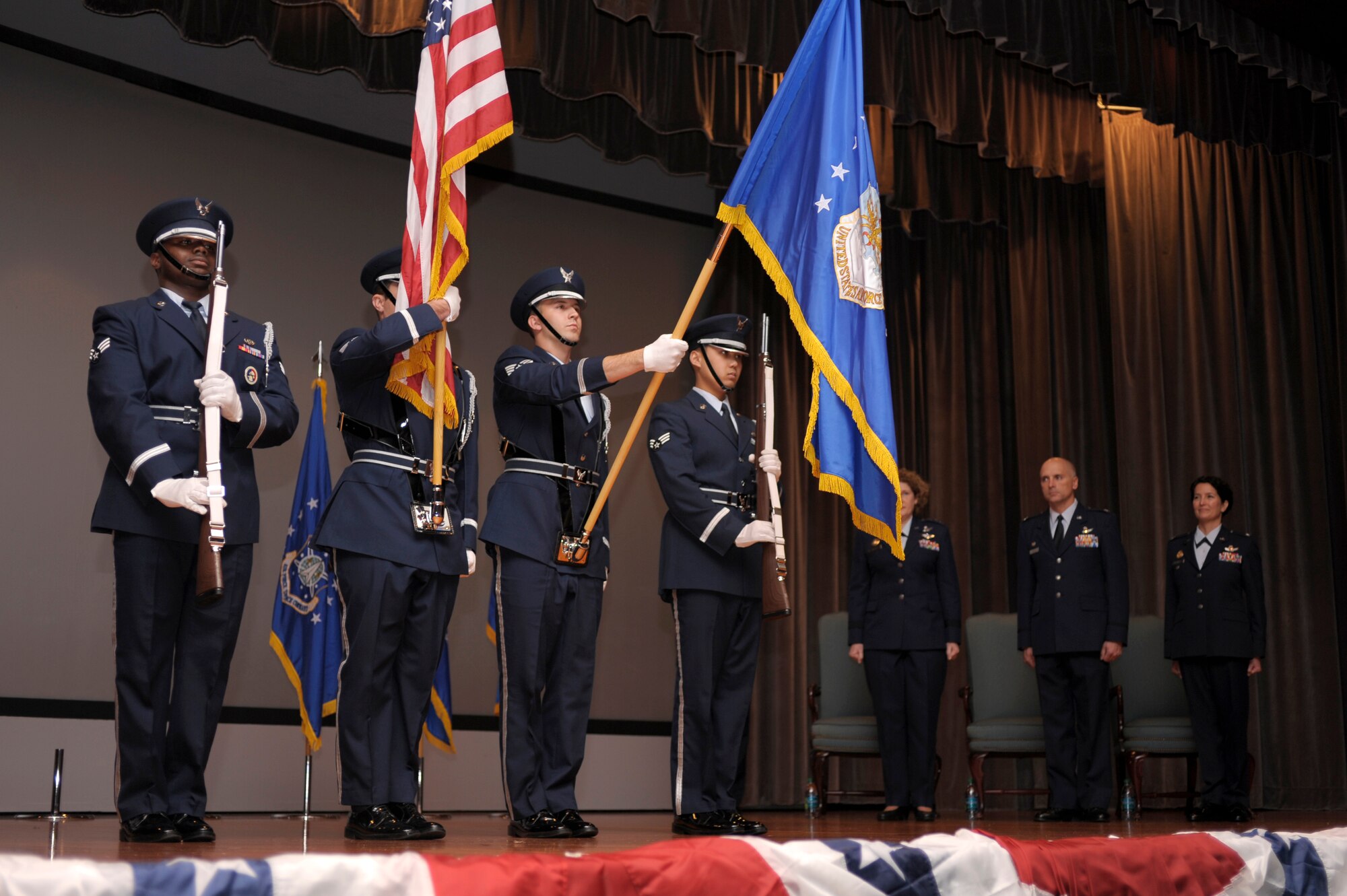 VANDENBERG AIR FORCE BASE, Calif. -- The Vandenberg Honor Guard post the colors during a 30th Space Wing change of command ceremony at the base theater Monday, Jan. 23, 2012. Col. Nina Armagno took command of the 30th SW at the ceremony from the former 30th SW commander, Col. Richard Boltz. (U.S. Air Force photo/Staff Sgt. Andrew Satran) 

 