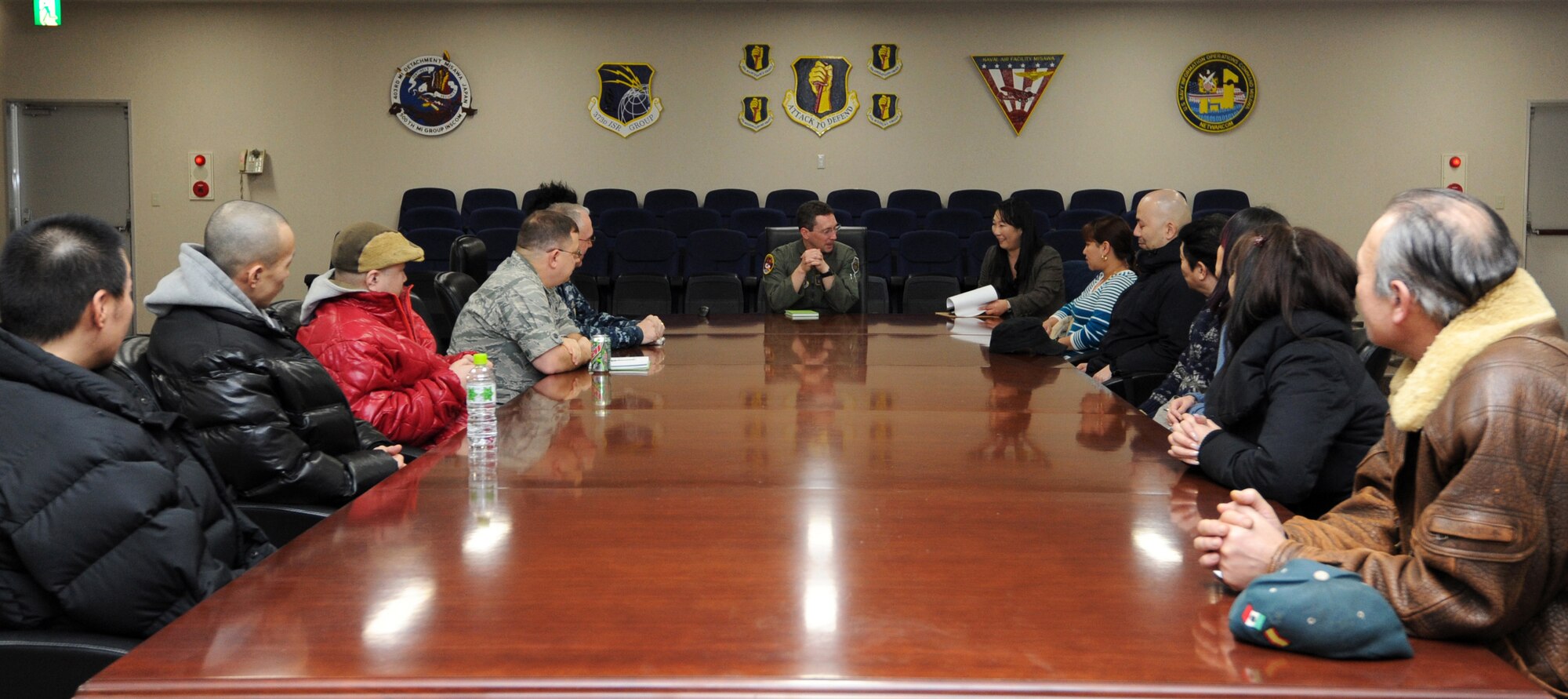MISAWA AIR BASE, Japan -- Col. Michael Rothstein, center, 35th Fighter Wing commander, listens to the concerns of Misawa bar owners here, Jan. 23. The purpose of this meeting was to keep an open dialogue with the local community and ensure Misawa service members are being good ambassadors. (U.S. Air Force Photo/Airman 1st Class Kia Atkins)