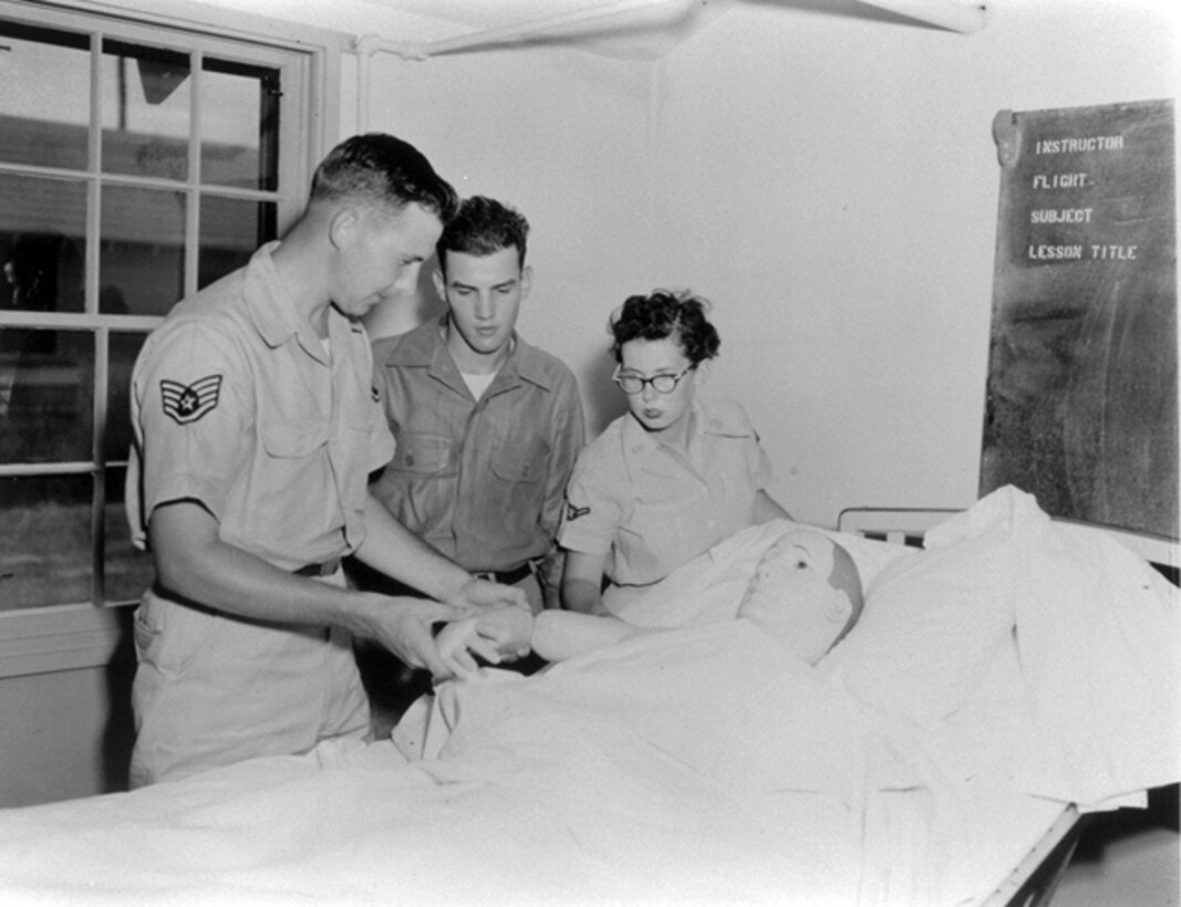 1966 -- An instructor shows students the correct way to administer patient care. (Courtesy photo)