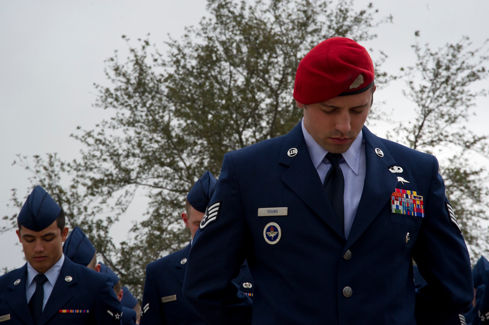 Staff Sgt. Dale Young, 342nd Training Squadron combat controller, bows his head in reflection during a memorial unveiling for Staff Sgt. Scott D. Sather, Jan. 20, 2012, Medina Annex, Lackland Air Force Base, San Antonio, Texas. Sather was the United States Air Force?s first combat casualty during Operation Iraqi Freedom.  The memorial, honoring Sather?s leadership and bravery, was sea-lifted from Sather Air Base, Baghdad, Iraq, to Lackland Air Force Base, Texas. (U.S. Air Force photo by Airman 1st Class Colville McFee)
