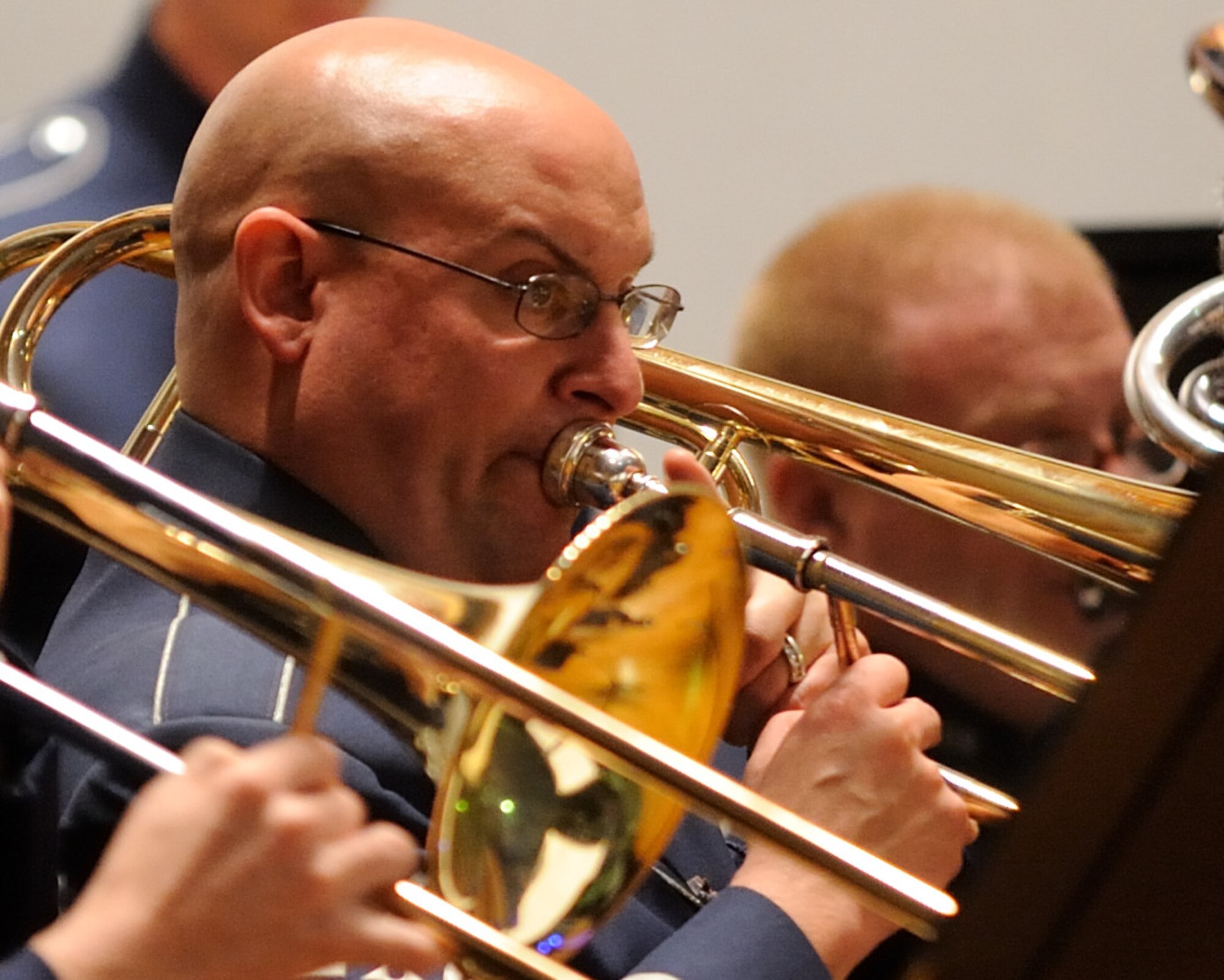 U.S. Air Force Tech. Sgt. Brandon Chaney, a trombonist and Henderson, Ky., native, plays during a concert by the U.S. Air Force Band Ceremonial Brass at MacDill Air Force Base, Fla., Jan. 23, 2012.  The Ceremonial Brass toured Florida Jan. 11-23 playing their first ever American concert tour.  U.S. Air Force photo by Master Sgt. Adam M. Stump/RELEASED.