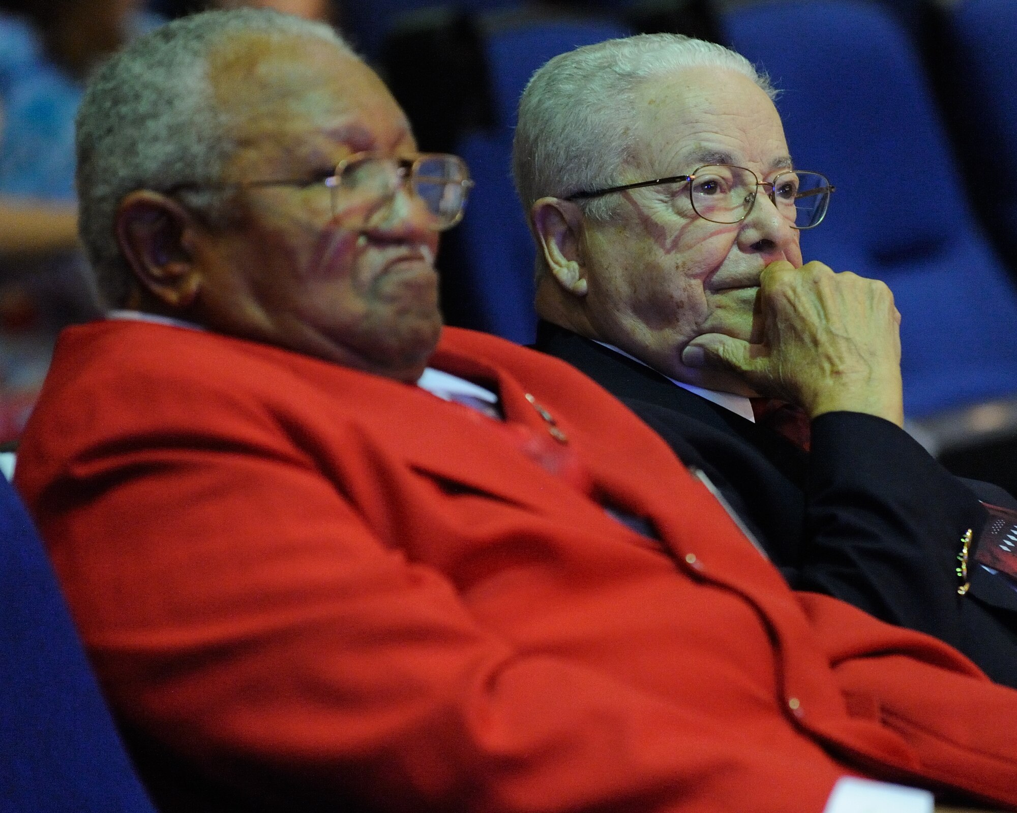From left, retired U.S. Army Col. George Brown, chaplain for the Tuskegee Airmen, Inc., Gen. Daniel "Chappie" James chapter, and retired Air Force Lt. Col. George Hardy, a Tuskegee Airman, watch the U.S. Air Force Band Ceremonial Brass perform at MacDill Air Force Base, Fla., Jan. 23, 2012.  The Ceremonial Brass toured Florida Jan. 11-23 playing their first ever American concert tour.  U.S. Air Force photo by Master Sgt. Adam M. Stump/RELEASED.