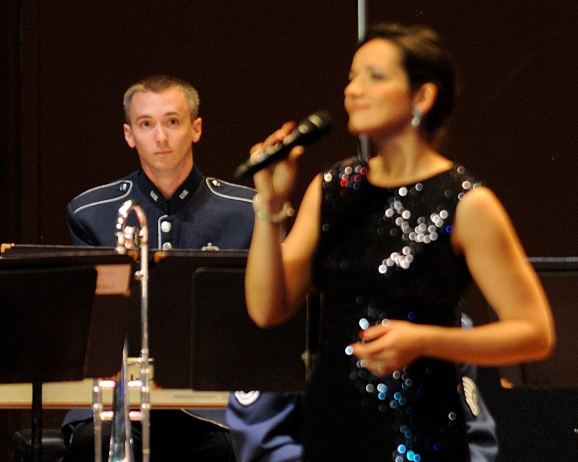 U.S. Air Force Tech. Sgt. Brian Mann, a native of Waseca, Minn., plays the piano while U.S. Air Force Tech. Sgt. Emily Lewis, an alto vocalist with the U.S. Air Force Band Singing Sergeants and a Lemoyne, Pa., native, sings "Somewhere Over the Rainbow during a concert by the U.S. Air Force Band Ceremonial Brass in Bradenton, Fla., Jan. 22, 2012.  The Ceremonial Brass toured Florida Jan. 11-23 playing their first ever American concert tour.  U.S. Air Force photo by Master Sgt. Adam M. Stump/RELEASED.