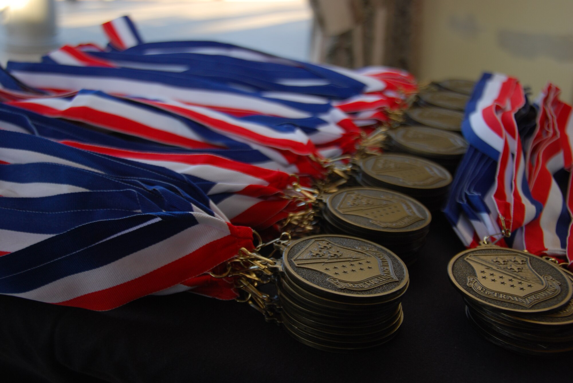 Medallions await presentation to each of the 82nd Training Wing's 2011 Annual Award nominees at the Wichita Falls Country Club Jan. 20, 2012. The Annual Awards Banquet guest speaker, Chief Master Sgt. of the Air Force #14 Gerald Murray presented a medallion to each nominee at the beginning of the evening. (U.S. Air Force photo/Capt. Brittany Martin)