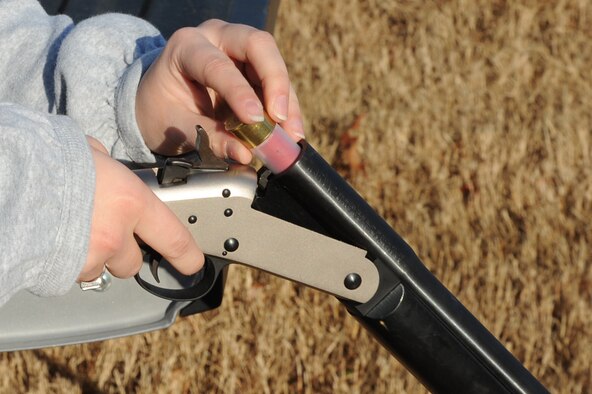 Samantha Whitworth places a cracker shell into a weapon during a wildlife patrol on Seymour Johnson Air Force Base, N.C., Jan. 20, 2012. Cracker shells make a loud noise to scare wildlife away from the flightline. Members of U.S. Department of Agriculture pester wildlife on the perimeter of the flightline to prevent them from making a home. Whitworth is a USDA volunteer from San Antonio. (U.S. Air Force photo/Senior Airman Whitney Stanfield)
