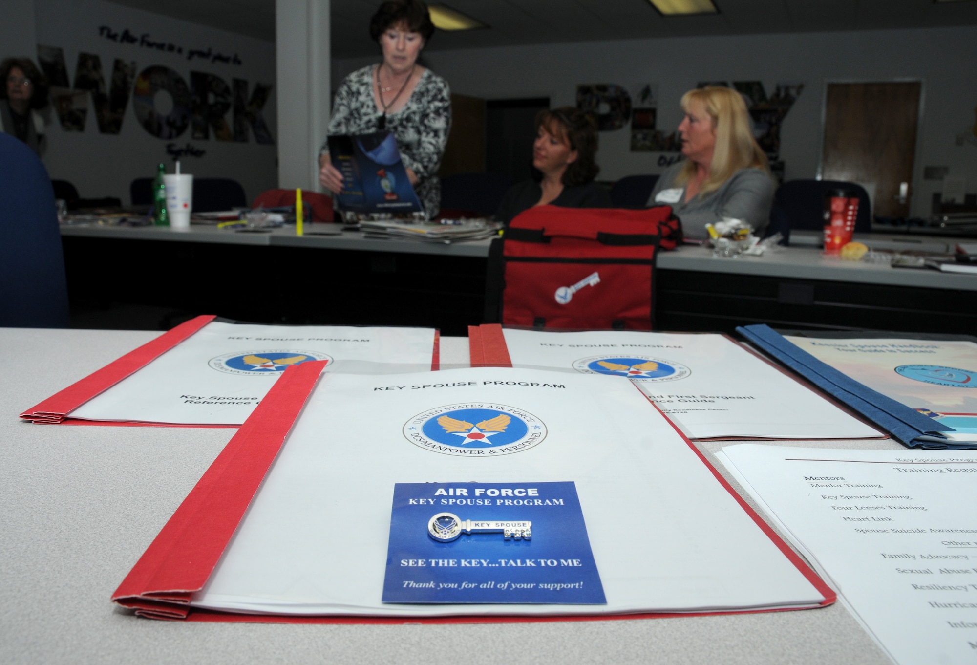 A Key Spouse pin is displayed during a Key Spouse program training session at the Sablich Center at Keesler Air Force Base, Miss., Dec. 12, 2012.  The Key Spouse program is the commanders’ and first sergeants’ link to get information to the spouses and families of squadron or unit members. A Key Spouse volunteers to represent and be the point of contact for a squadron and is charged with making sure important information gets communicated.  (U.S. Air Force photo by Kemberly Groue)