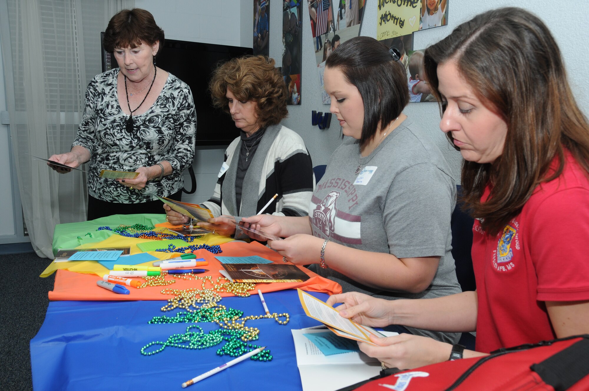 Becky Stanley, the airman and family readiness center’s personal and family life program manager, performs an training exercise for new members of the Key Spouse program, Rochelle Malone, Sue Ellen Roberts and Amy Wier, at the Sablich Center at Keesler Air Force Base, Miss., Dec. 12, 2012. The Key Spouse program is the commanders’ and first sergeants’ link to get information to the spouses and families of squadron or unit members. A Key Spouse volunteers to represent and be the point of contact for a squadron and is charged with making sure important information gets communicated.  (U.S. Air Force photo by Kemberly Groue)