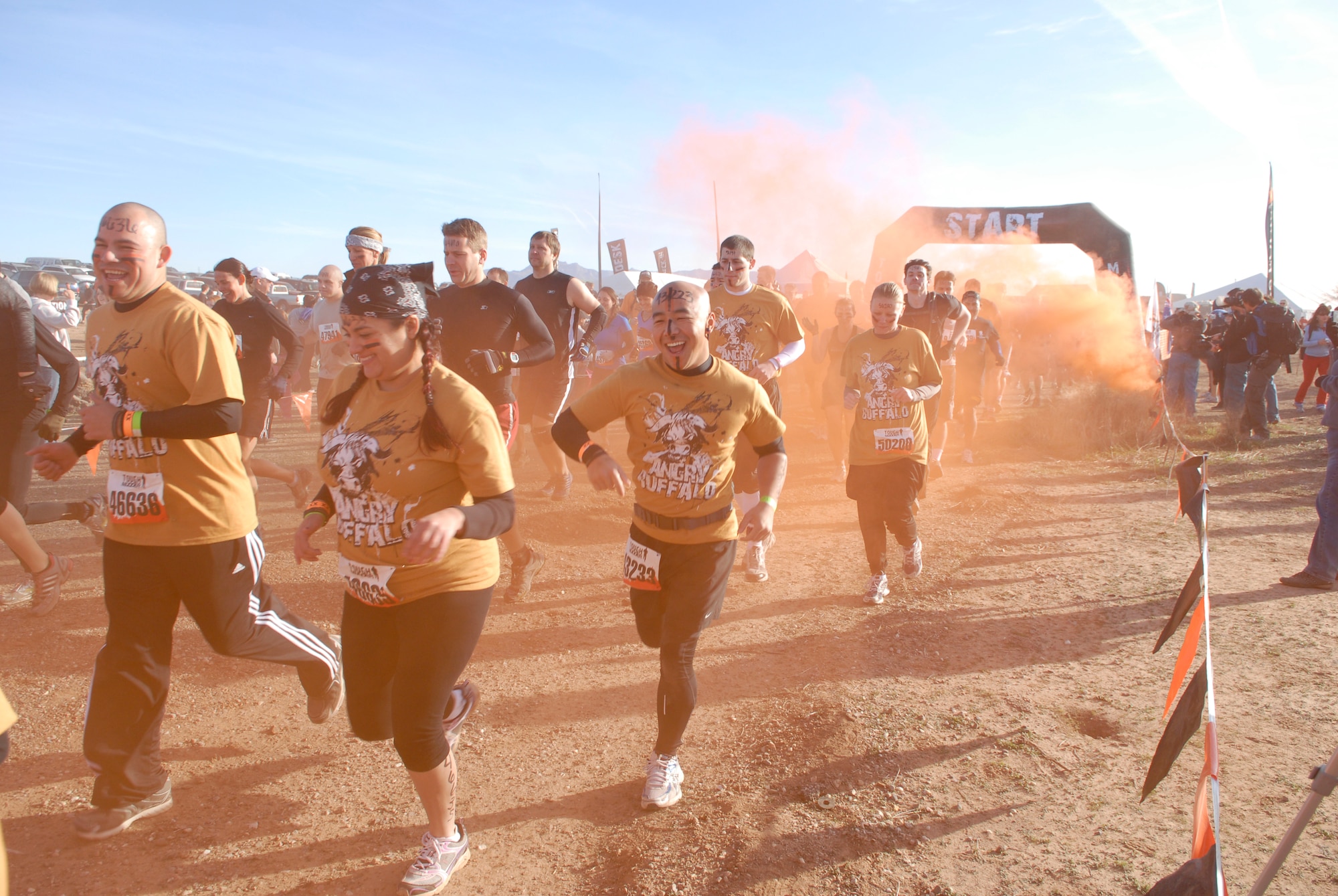 Luke Air Force Base members begin the Tough Mudder Jan. 14 by running through gas at the Mesa Proving Grounds in Mesa, Ariz. The course was 12.5 miles long with 29 obstacles. (U.S. Air Force photo by Airman 1st Class David Owsianka)