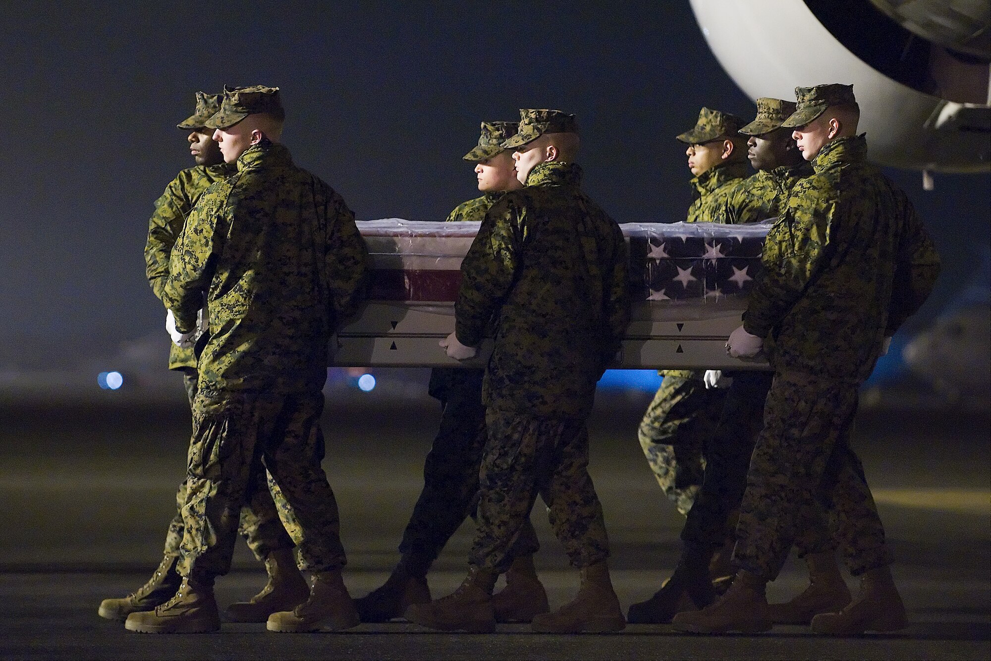 A U.S. Marine Corps carry team transfers the remains of Marine Cpl. Jesse W. Stites, of North Beach Md., at Dover Air Force Base, Del., Jan. 23, 2012. Stites was assigned to Marine Heavy Helicopter Squadron 363, Marine Aircraft Group 24, 1st Marine Aircraft Wing, III Marine Expeditionary Force, Kaneohe Bay, Hawaii. (U.S. Air Force photo/Steve Kotecki)