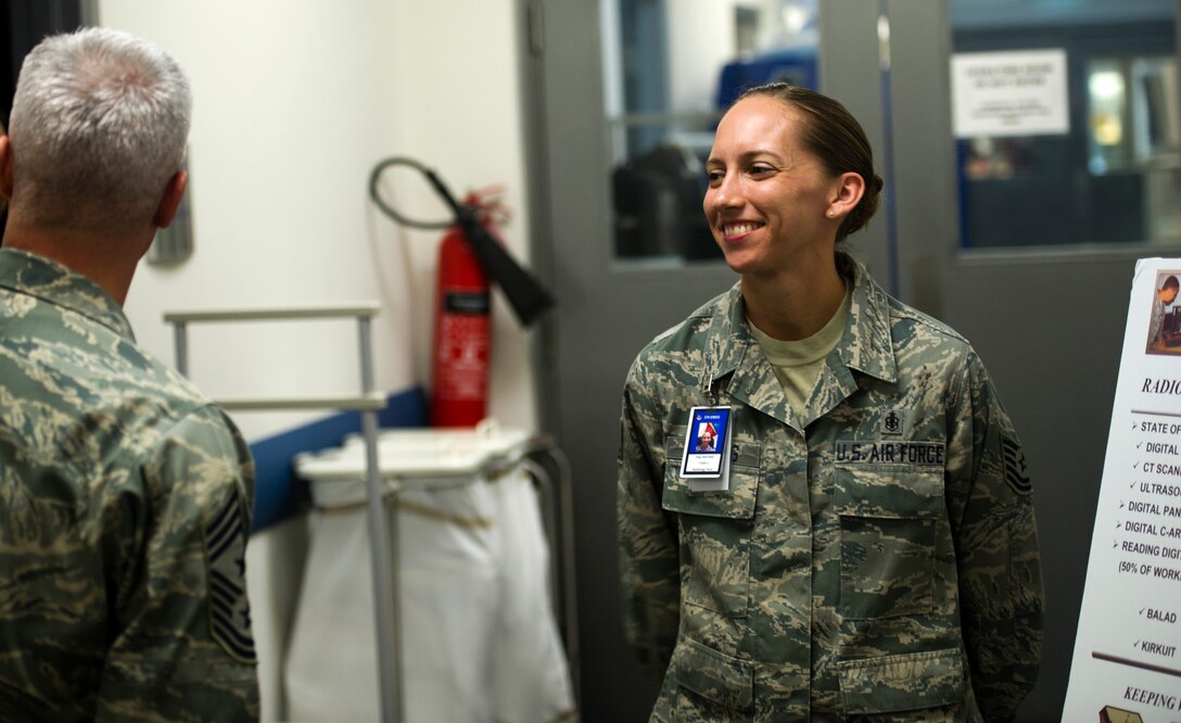 From right, U.S. Air Force Tech. Sgt. Tamra Whiting, 379th Expeditionary Medical Group and native of Richmond, Ind., enjoys a laugh along with U.S. Air Force Chief Master Sgt. Robert Sealey, U.S. Air Forces Central Command command chief, during a visit of the 379th MDG's radiology department at an undisclosed location in Southwest Asia, Jan 18, 2012. Whiting, who's currently deployed from the 28th Medical Group, Joint Base Langley-Eustis, Va., is the NCO in charge of the radiology department here.  During this visit, Sealey was briefed about the Medical Group's abilities and main mission here. Sealey went on to visit several other units through the wing here. (U.S. Air Force photo by Staff Sgt. David Salanitri/Released)