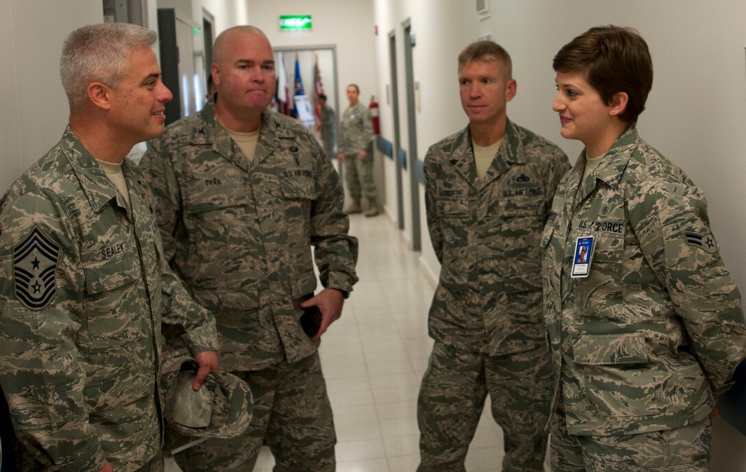 From right, U.S. Air Force Airman 1st Class Crystal Landers, 379th Expeditionary Medical Group, briefs U.S. Air Force Chief Master Sgt. Robert Sealey, U.S. Air Forces Central Command command chief, about her duties here as a medial and orthopedic technician.  Landers, a native of Wichita, Kan., is currently deployed from the 633rd Inpatient Operations Squadron, Joint Base Langley-Eustis, Va. (U.S. Air Force photo by Staff Sgt. David Salanitri)