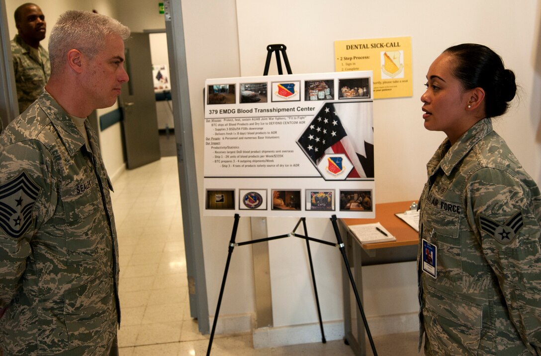 From left, U.S. Air Force Senior Airman Vicky Santos, 379th Expeditionary Medical Group, explains the duties of the hospital's labortory to U.S. Air Force Chief Master Sgt. Robery Sealey, U.S. Air Forces Central Command command chief, Jan 18, 2012 at an undisclosed location in Southwest Asia.  Santos, a native of San Francisco, Calif., is currently deployed from the 633rd Medical Support Squadron, Joint Base Langley-Eustis, Va. (U.S. Air Force photo bt Staff Sgt. David Salanitri)