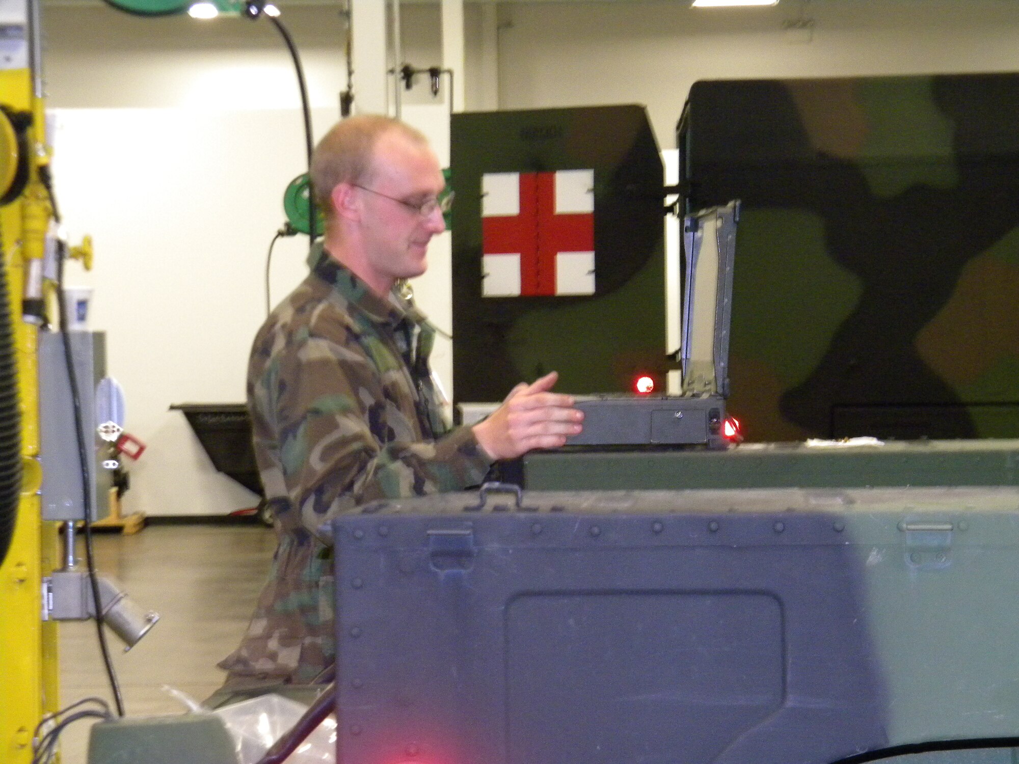 U.S. Army Specialist Vince Driver, 7th Sustainment Brigade wheeled vehicle mechanic, uses a new, electronic operator’s manual for a High Mobility Multi Wheeled Vehicle at AM General's Research and Development plant in Livonia, Mich., in Dec. 2011. Soldiers took part in a vehicle maintenance upgrade program that will improve the process for years to come. (Courtesy photo)