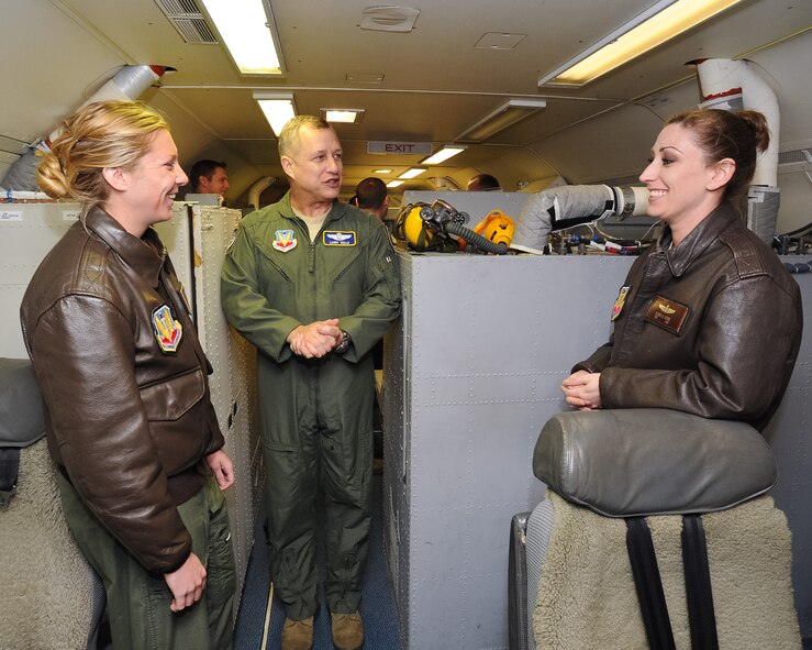 Maj. Gen. Lawrence Wells, 9th Air Force commander, center, talks with E-8 Joint STARS crewmembers, Senior Airman Shannon Crippen, 330th Combat Training Squadron, left, and Tech. Sgt. Elissa Fudge, 16th Airborne Command and Control Squadron, during a visit to Robins Air Force Base, Ga., Jan. 17, 2012.  Wells toured the jet during a two-day trip to JSTARS for an orientation of the 461st Air Control Wing.  This was Wells' first visit since the activation of the 461st ACW.   (Air National Guard photo by Master Sgt. Roger Parsons/Released)