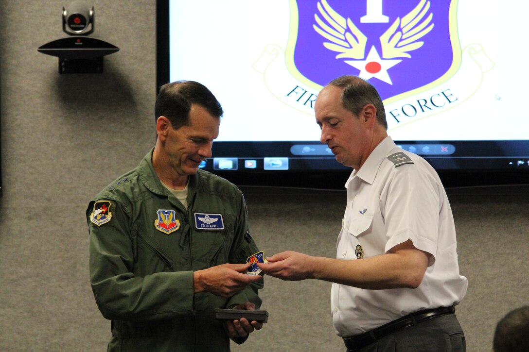 Civil Air Patrol Col. Al Bedgood, CAP Southeast Region commander, presents a CAP patch to Lt. Gen. Sid Clarke, Continental U.S. NORAD Region-1st Air Force (Air Forces Northern) commander, during their regional conference at Tyndall Air Force Base, Fla., Jan. 21. CAP is a nonprofit, volunteer organization. In its Air Force Auxiliary role, CAP performs 90 percent of continental U.S. inland search and rescue missions as tasked by the AFRCC and was credited with saving 53 lives in 2011. CAP also provides assistance in 1st Air Force’s homeland defense mission. (U.S. Air Force photo by Angela Pope)