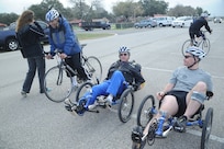 Adaptive Fitness and Sports Camp participants Robert Hudson (left), Noel Sepulveda and Claude Owens prepare for the bike race at Eberle Park on Joint Base san Antonio-Randolph Jan. 19. Forty five Air Force, Navy and U.S. Special Operations Command Wounded Warriors participated in the inaugural Adaptive Fitness & Sports Camp held at JBSA- Randolph  Jan. 18-21. Events included wheelchair basketball, sitting volleyball, cycling, aquatics, strength and conditioning, adaptive bowling and golf opportunities. (U.S. Air Force photo/Rich McFadden) (released)