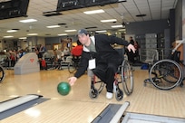 Patrick Roberts, Adaptive Fitness and Sports Camp participant, tries his hand at wheelchair bowling at the bowling ally on Joint Base San Antonio-Randolph Jan. 18. Forty five Air Force, Navy and U.S. Special Operations Command Wounded Warriors participated in the inaugural Adaptive Fitness & Sports Camp held at JBSA- Randolph  Jan. 18-21. Events included wheelchair basketball, sitting volleyball, cycling, aquatics, strength and conditioning, adaptive bowling and golf opportunities. (U.S. Air Force photo/Rich McFadden) (released)
